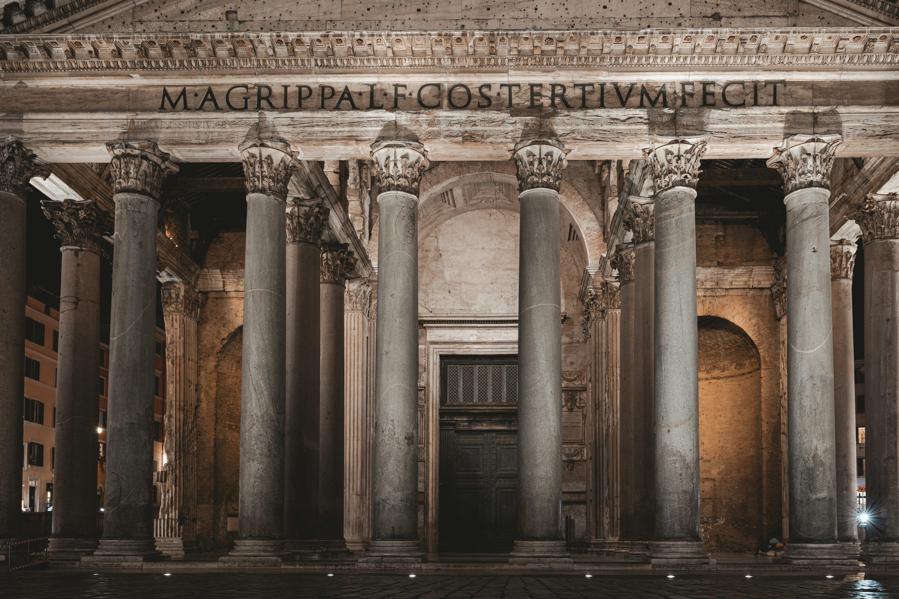 3000x2000 A building with columns and a clock on the front of it photo