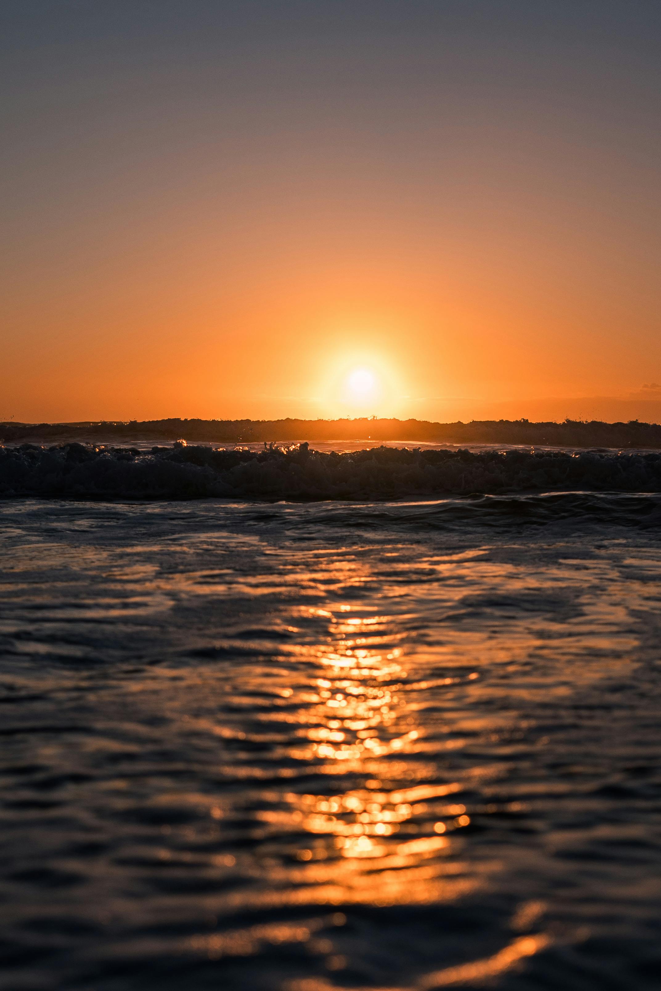 2145x3217 Serene Sunset over Ocean Waves at Twilight · Free
