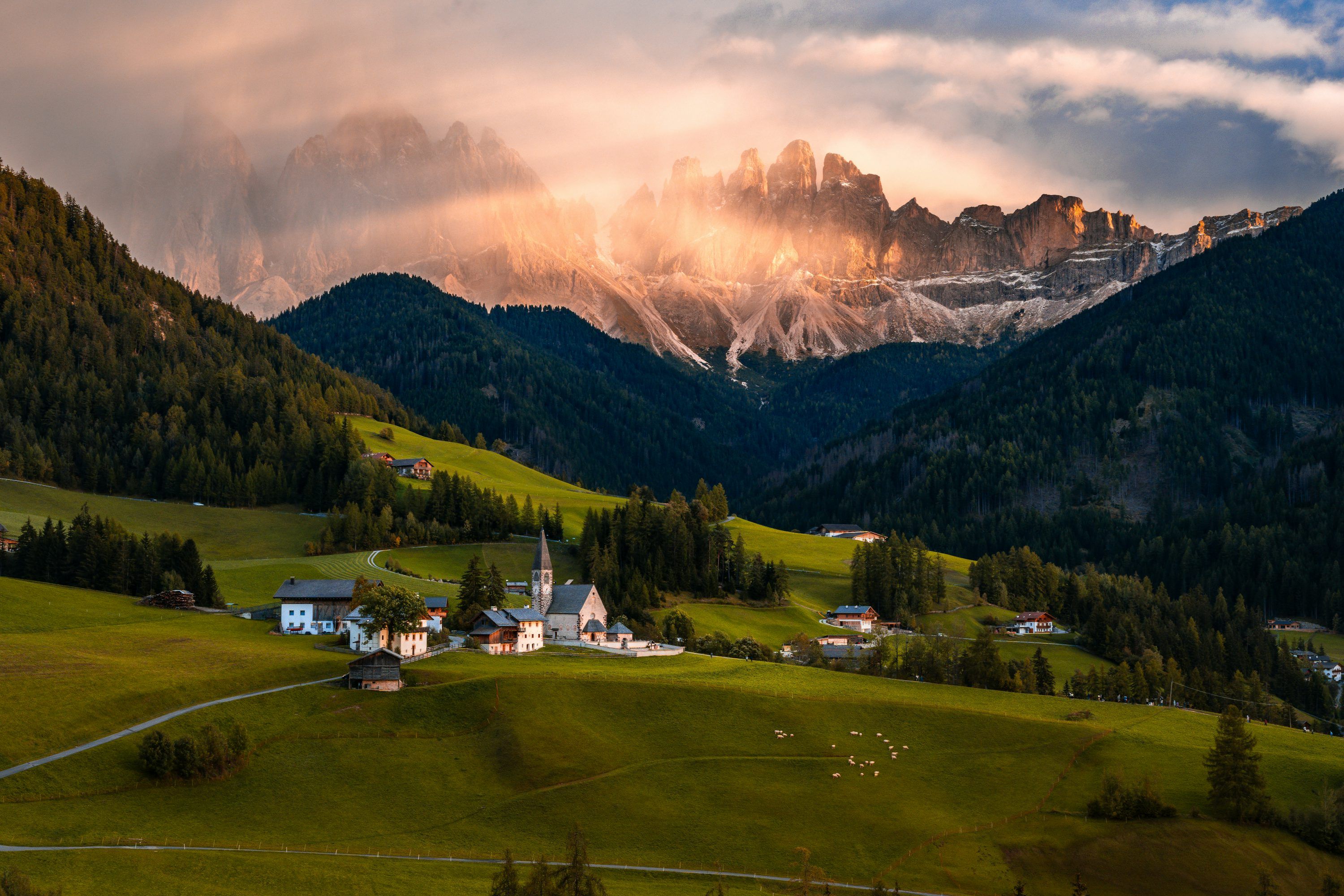 3000x2000 A scenic view of a mountain range with a church in the foreground photo