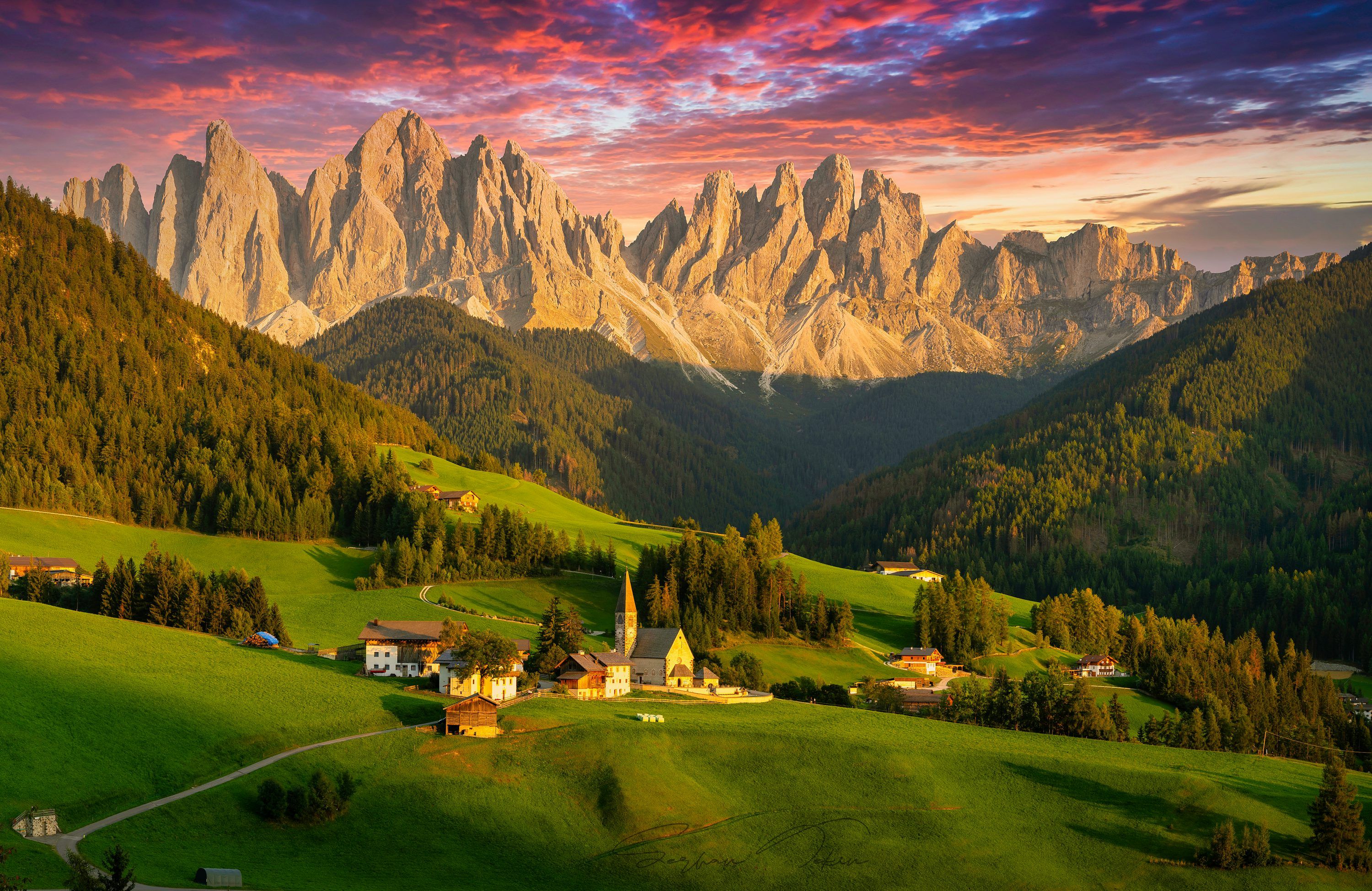 3000x1949 A scenic view of a mountain range with a church in the foreground photo