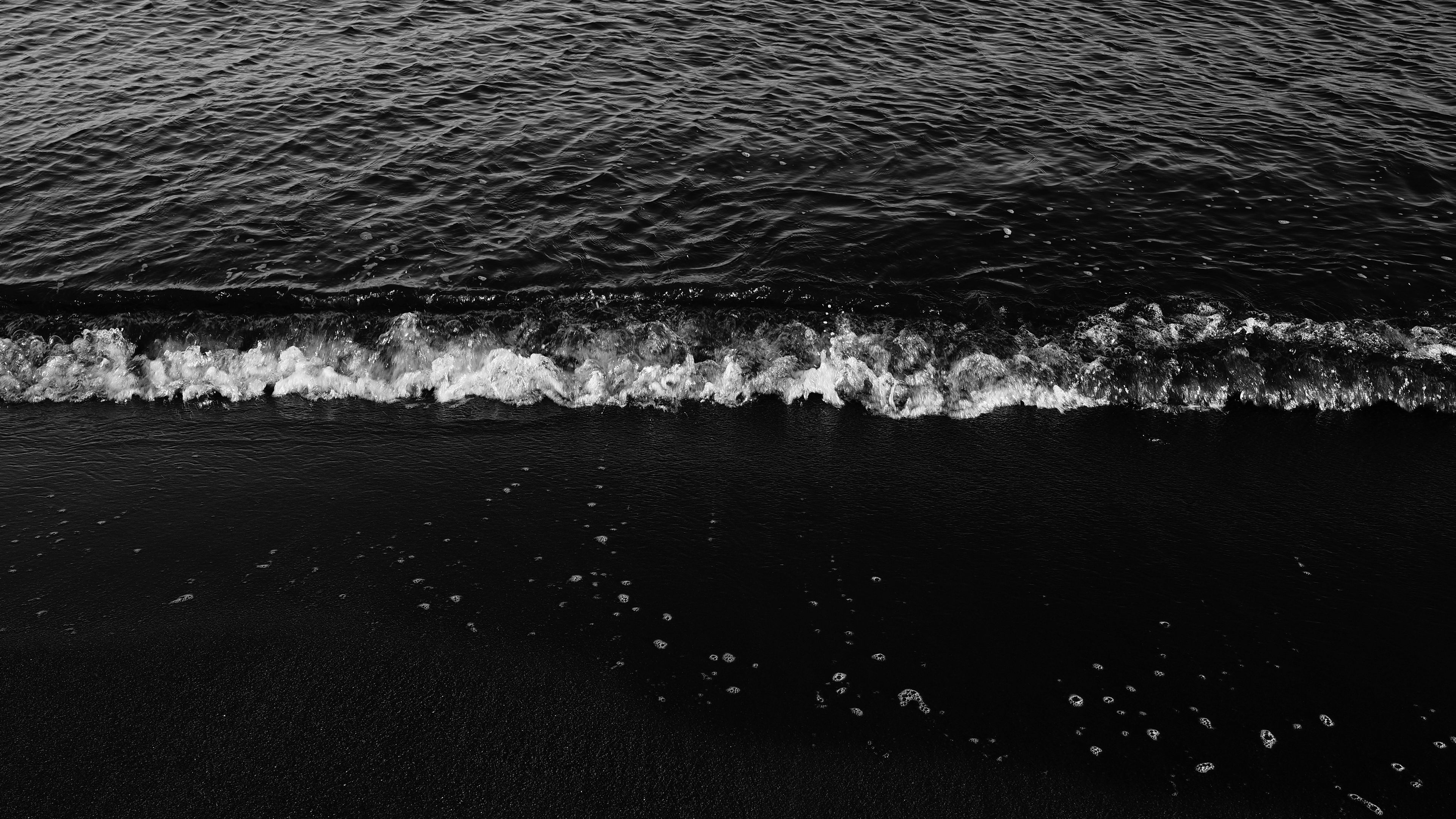 3840x2160 Download wallpaper 3840x2160 waves, bw, surf, foam, sand, dark, water, sea 4k uhd 16:9 HD background