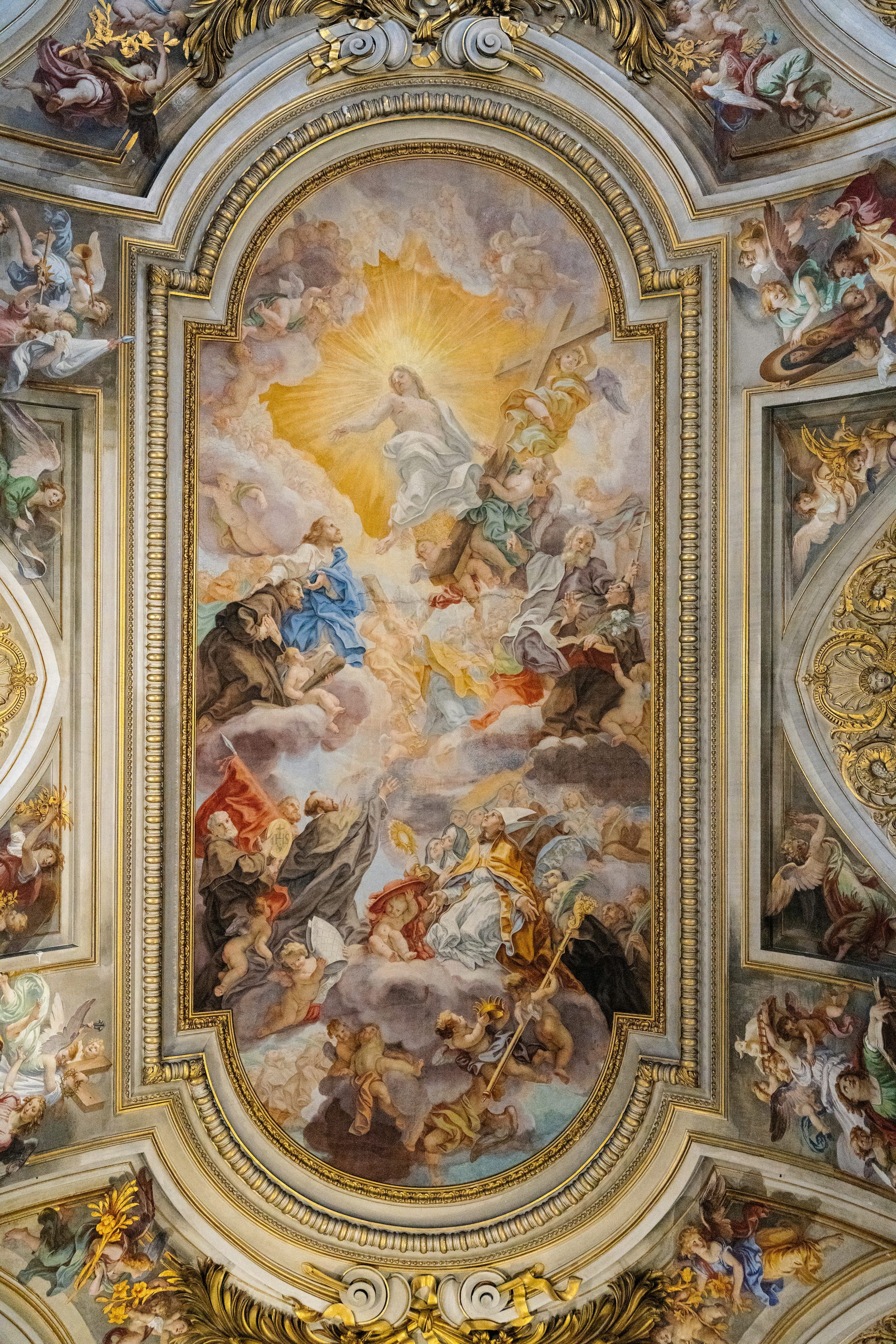 3000x4500 The ceiling of a building with a painting on it photo