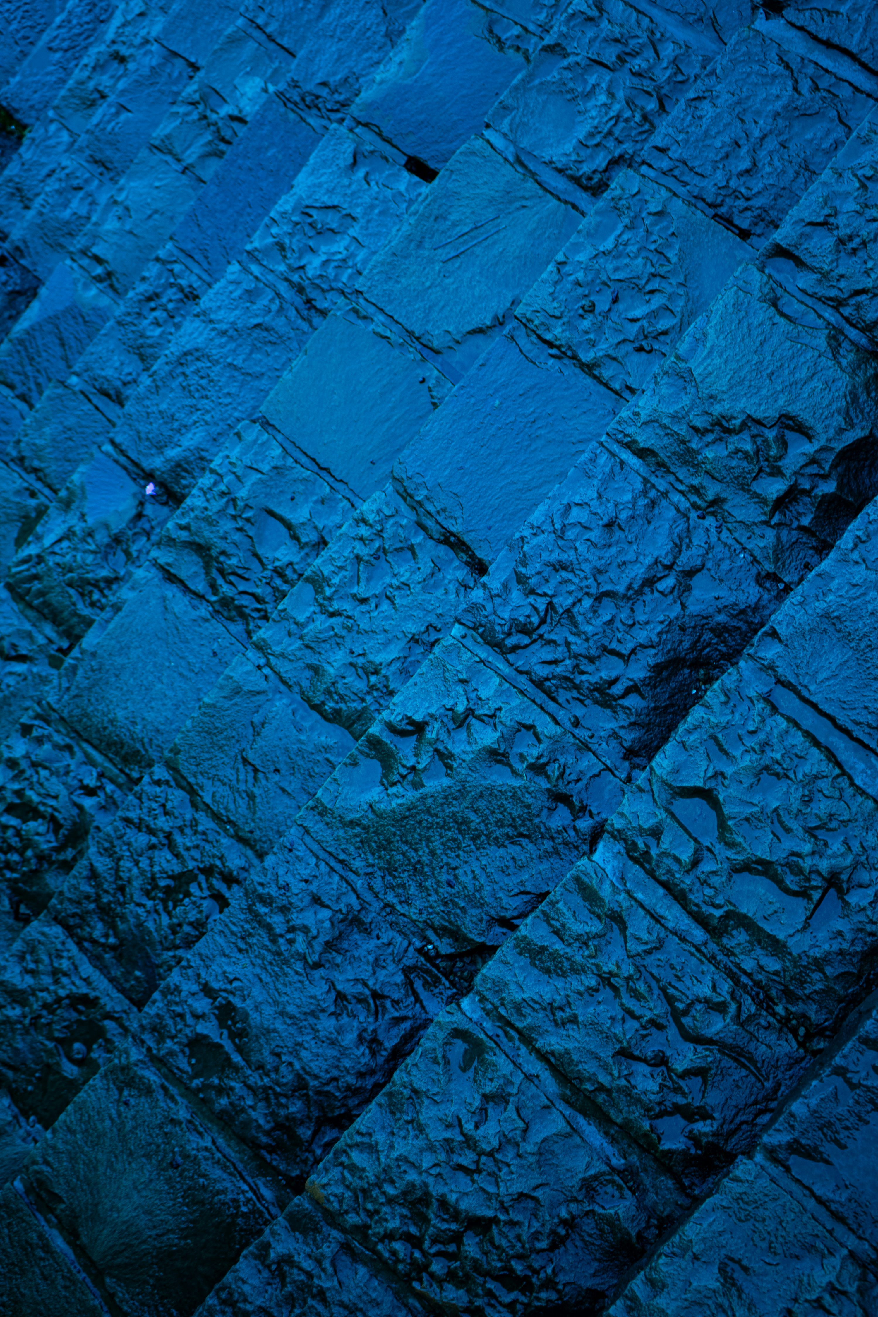 3000x4500 Blue stone wall: a geometric pattern. photo