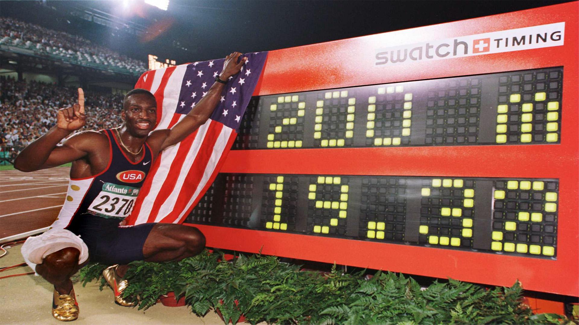 1920x1080 Michael Johnson Poses With The Timer After He Set a 200m World Record at the 1996 Atlanta Olympics On August 1st, 1996. His World Record Stood For 13 Years. [1920x1080]