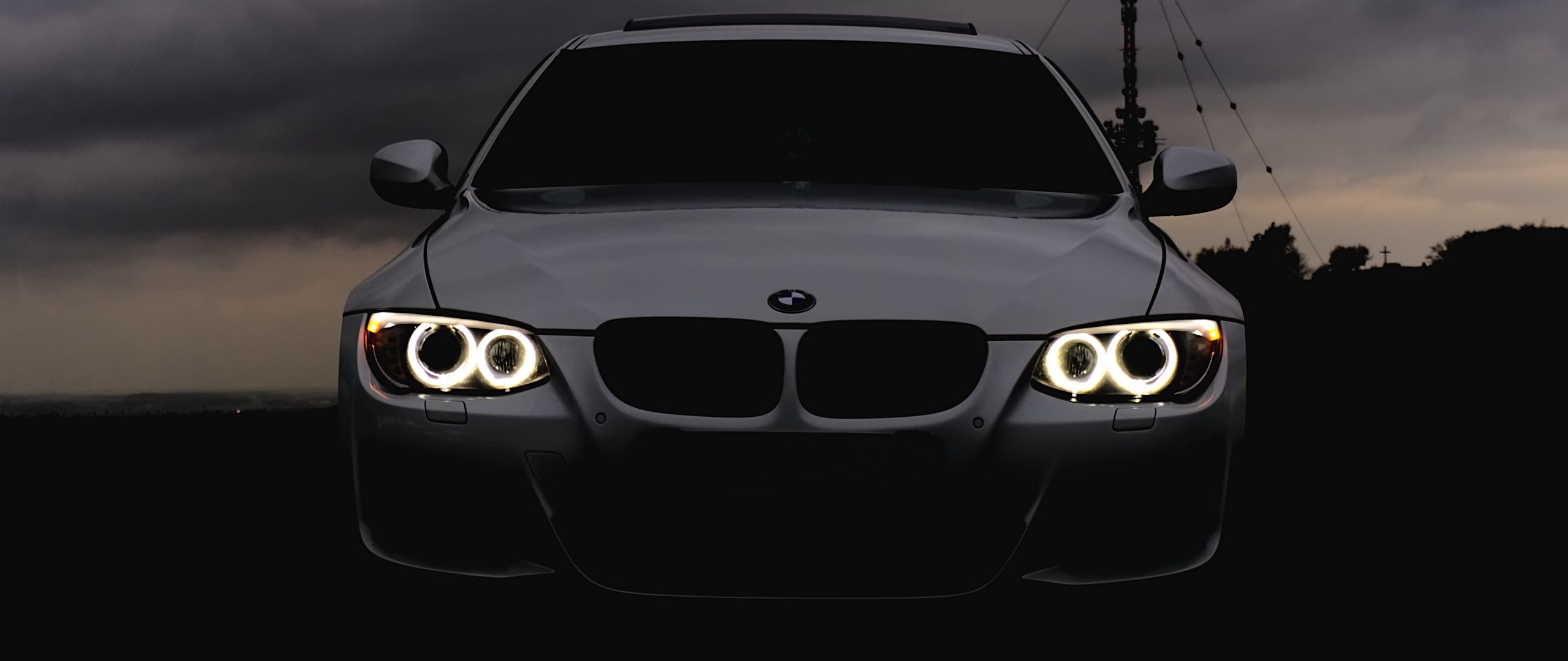 2560x1080 Download wallpaper 2560x1080 bmw, headlights, car, cloudy, overcast dual wide 1080p HD background