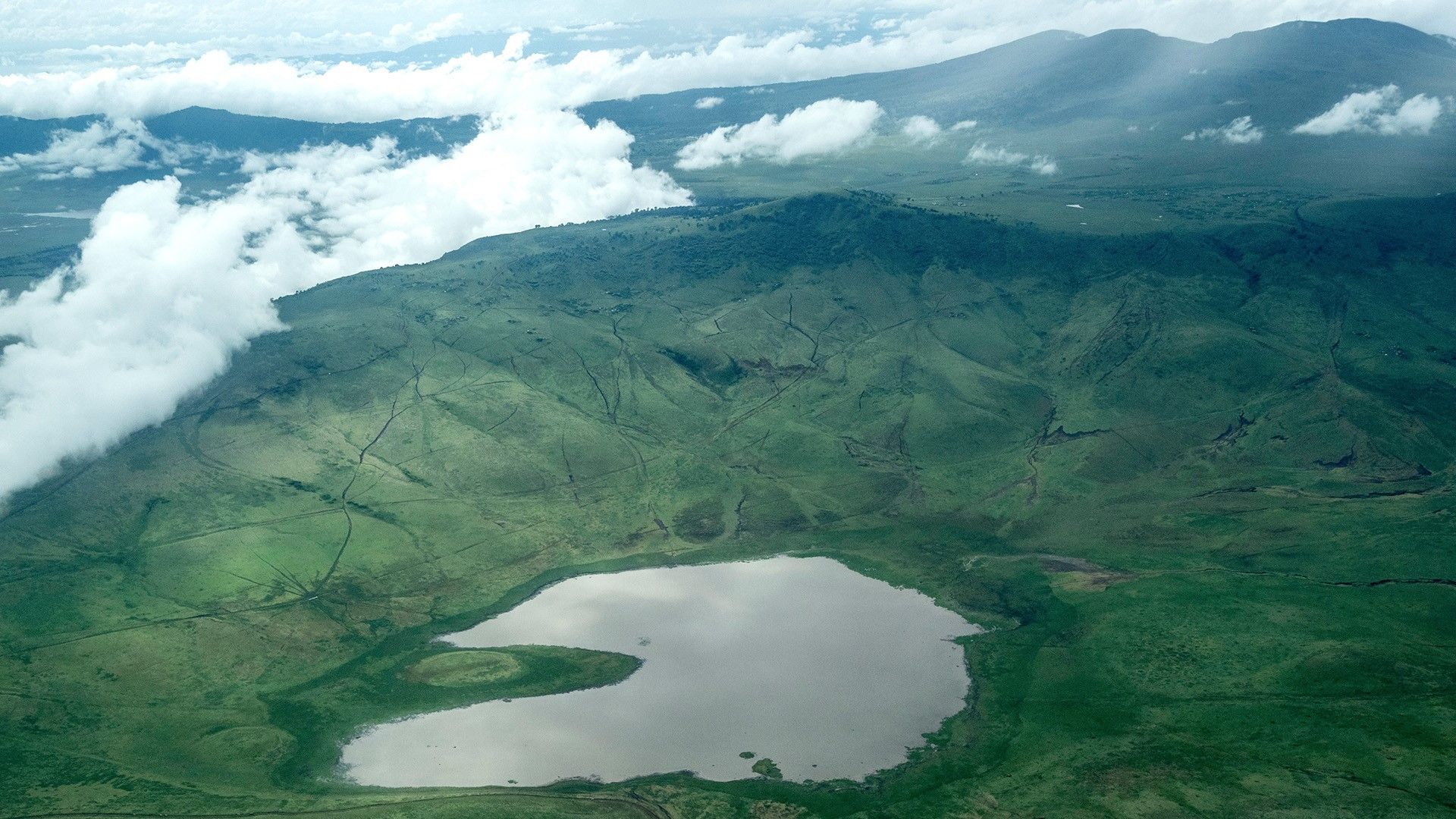 1920x1080 Aerial view of Ngorongoro Crater in the Ngorongoro Conservation Area, Tanzania. Windows Spotlight Image
