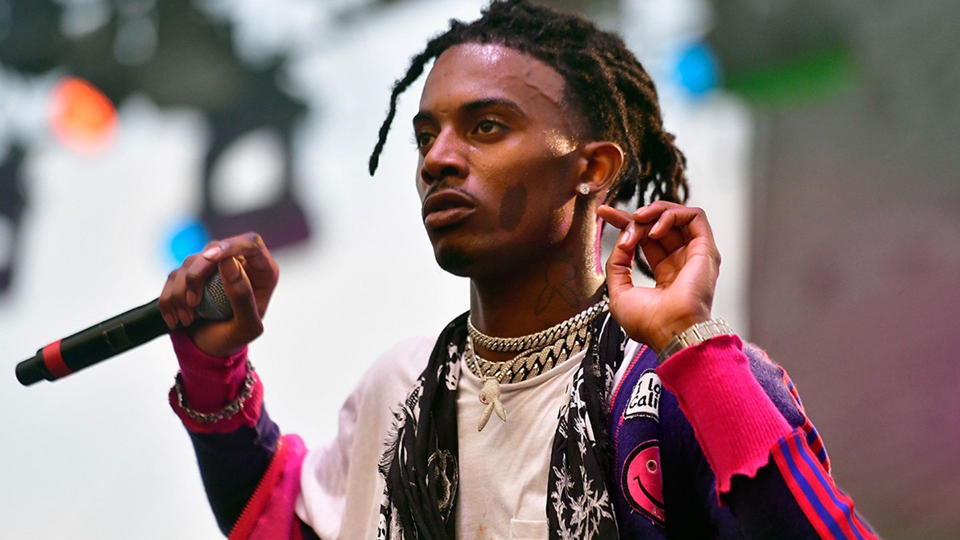 1920x1080 Playboi Carti With Mike Is Wearing Colorful Dress And Silver Chains Standing In Blur Bokeh Background HD Playboi Carti Wallpaper