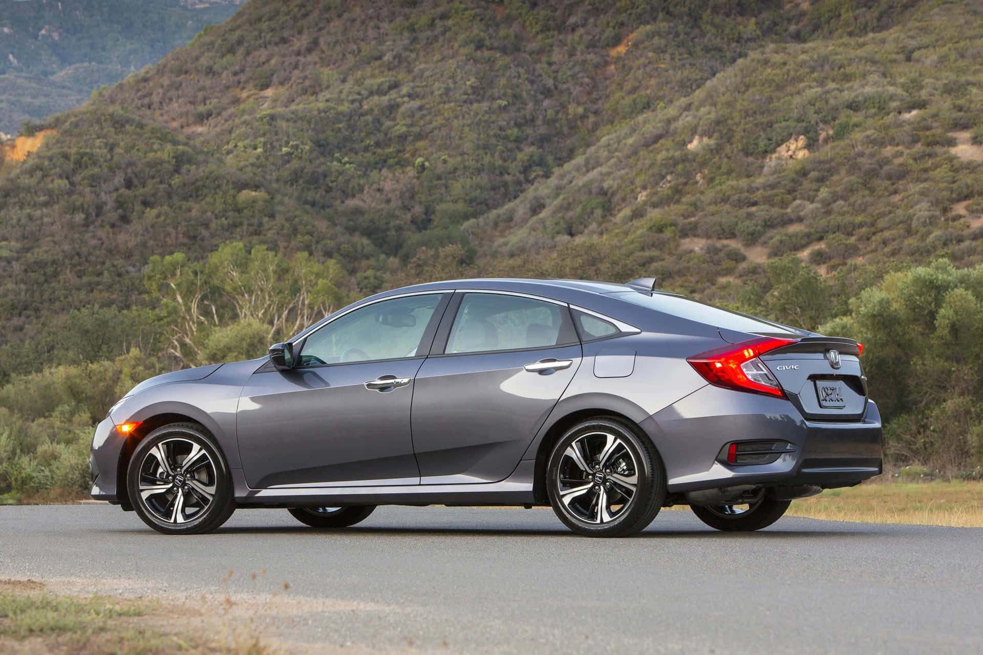 1920x1280 Download The 2017 Honda Civic Sedan Is Driving Down A Country Road