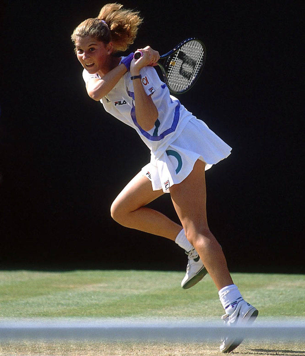 1029x1200 Download Caption: Monica Seles in Action during a Tennis Match Wallpaper
