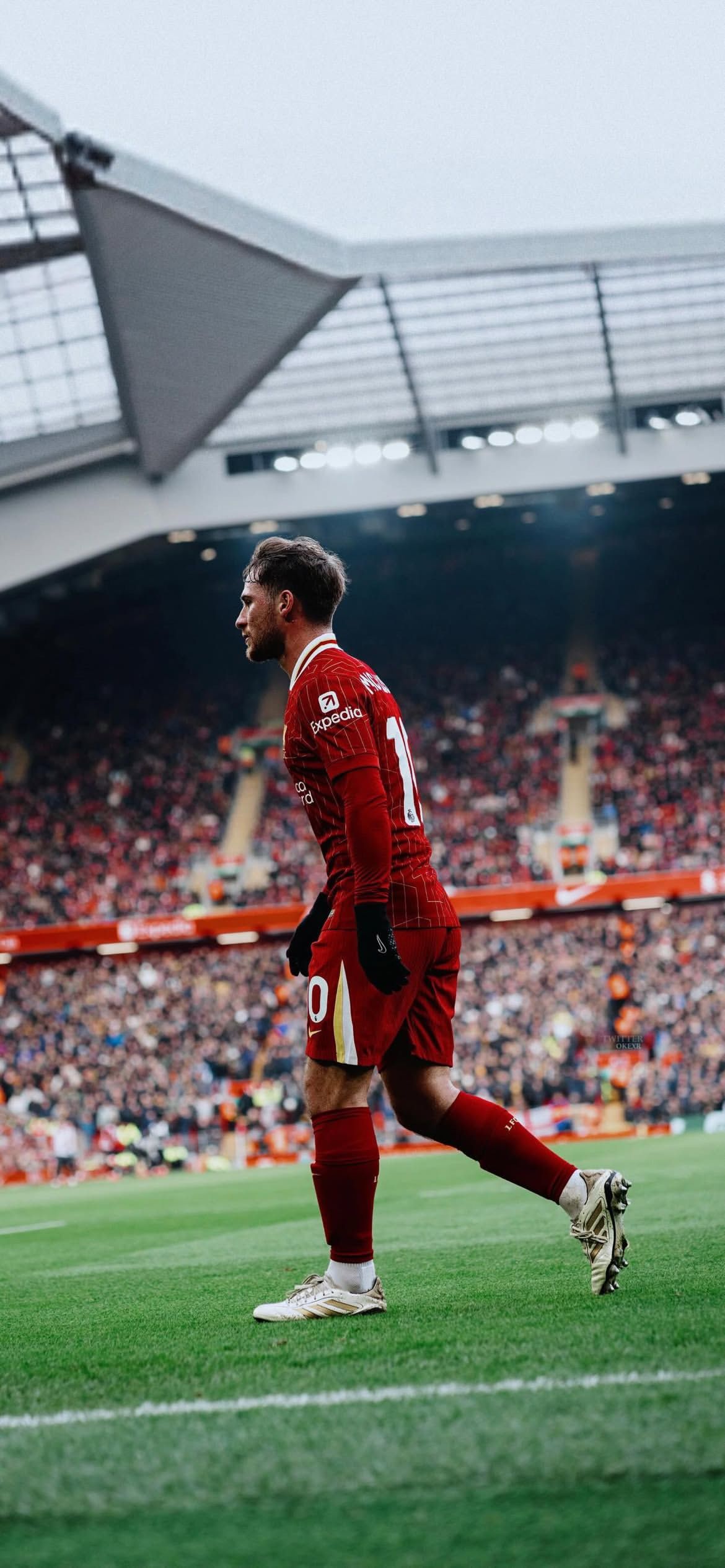 1170x2531 Alexis Mac Allister walking at Anfield for Liverpo Football Wallpaper