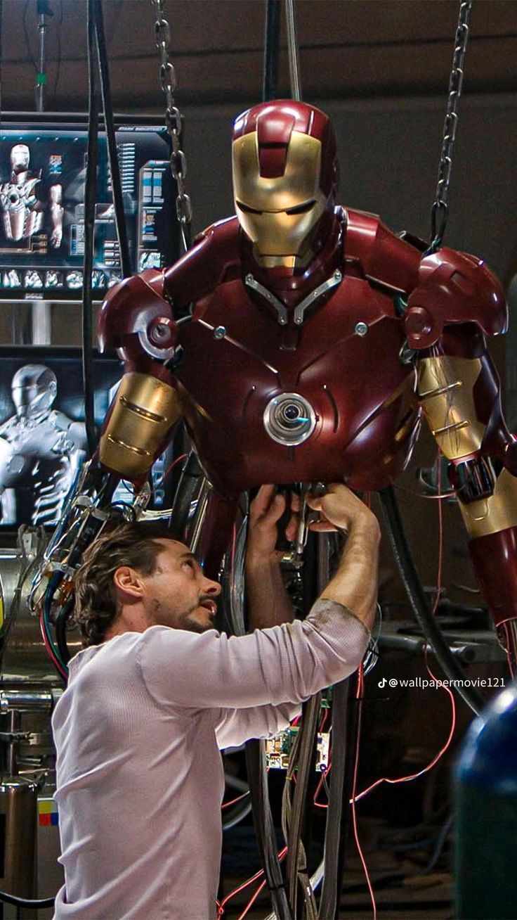 736x1308 Tony Stark repairing his armour