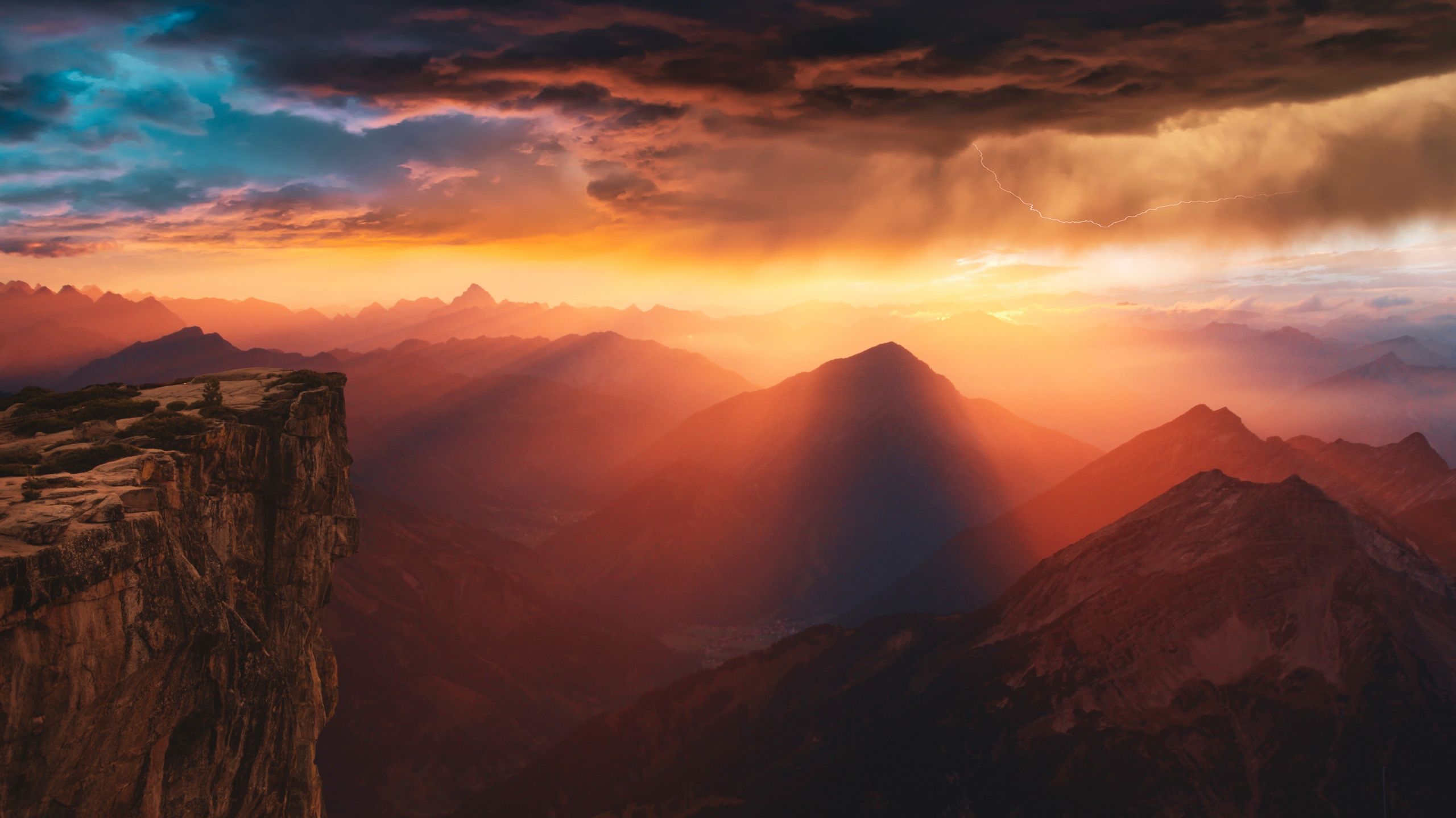 2560x1440 Sunlight Wallpaper 4K, Mountains, Sunset, Storm, Cliff