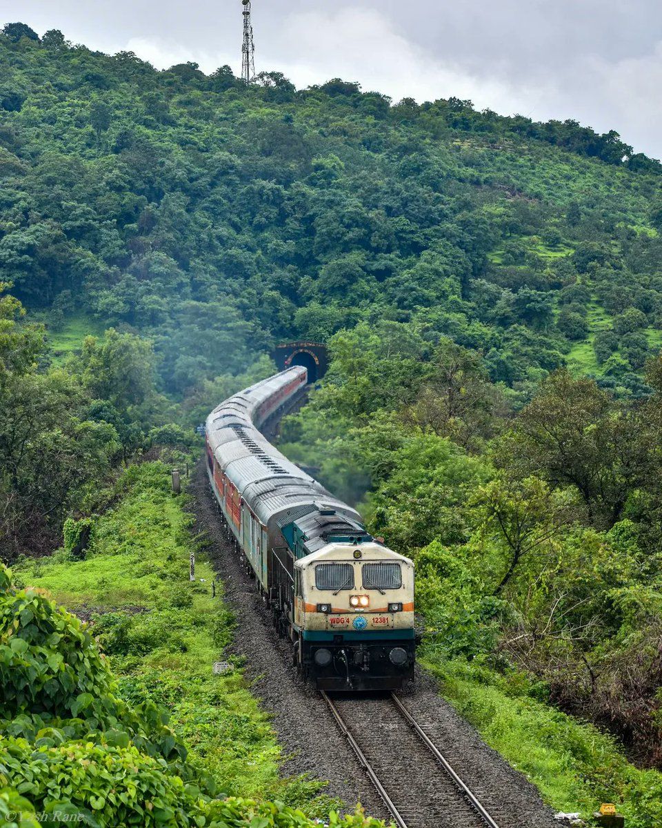 960x1200 The beautiful lush greenery of the Sahyadris in full view as a train exits a tunnel and passesely landscape near Nivasar station on the route, captured before COVID