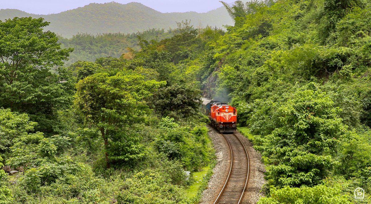 1200x660 Captivating ! Spectacular scene of train making its wayh green and beautiful Western Ghats of the Konkan region between Harwada and Ankola Station