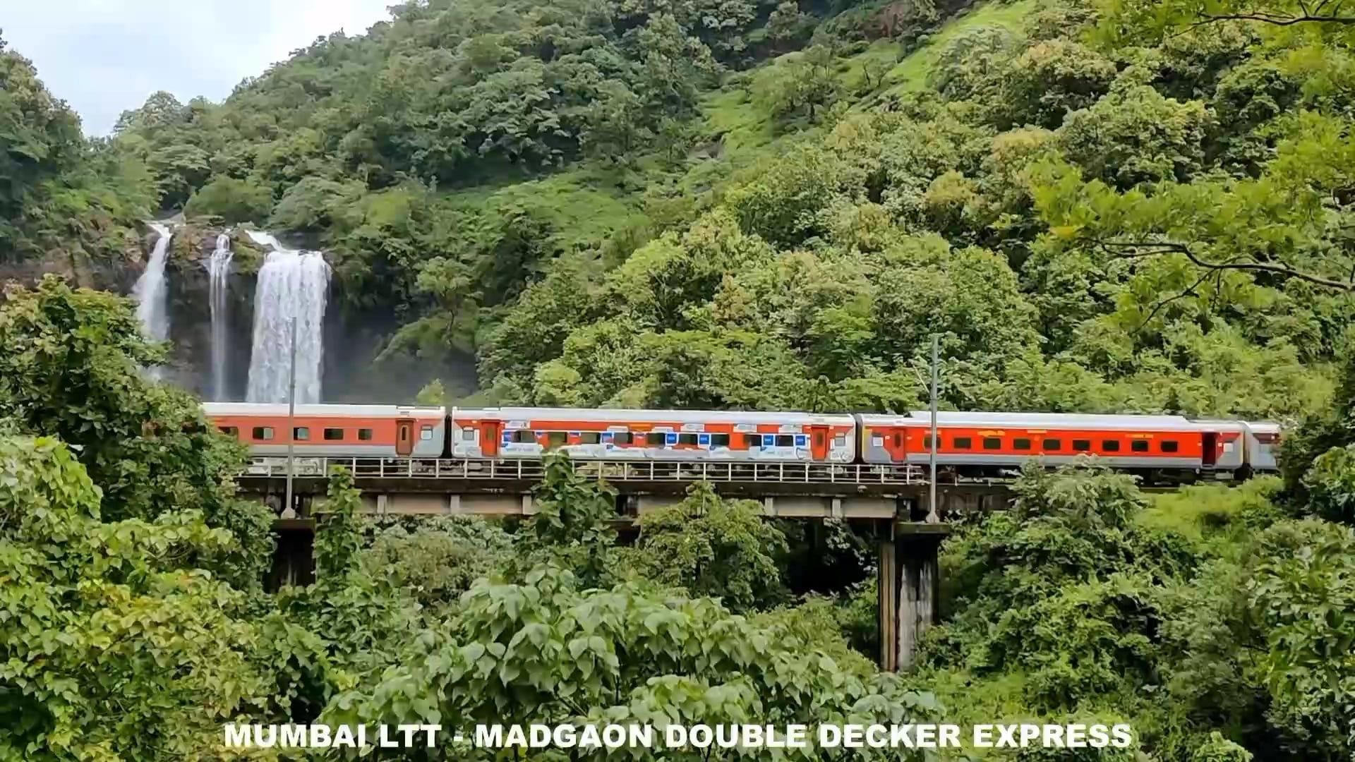 1920x1080 An Indian Railway train passing through a railway bridge near the beautiful Ranpat waterfall in Ratnagiri, Maharashtra, India