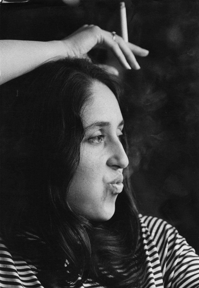 829x1200 Joan Baez smoking a cigarette, Paris, 1970. Photo by Reporters Associés