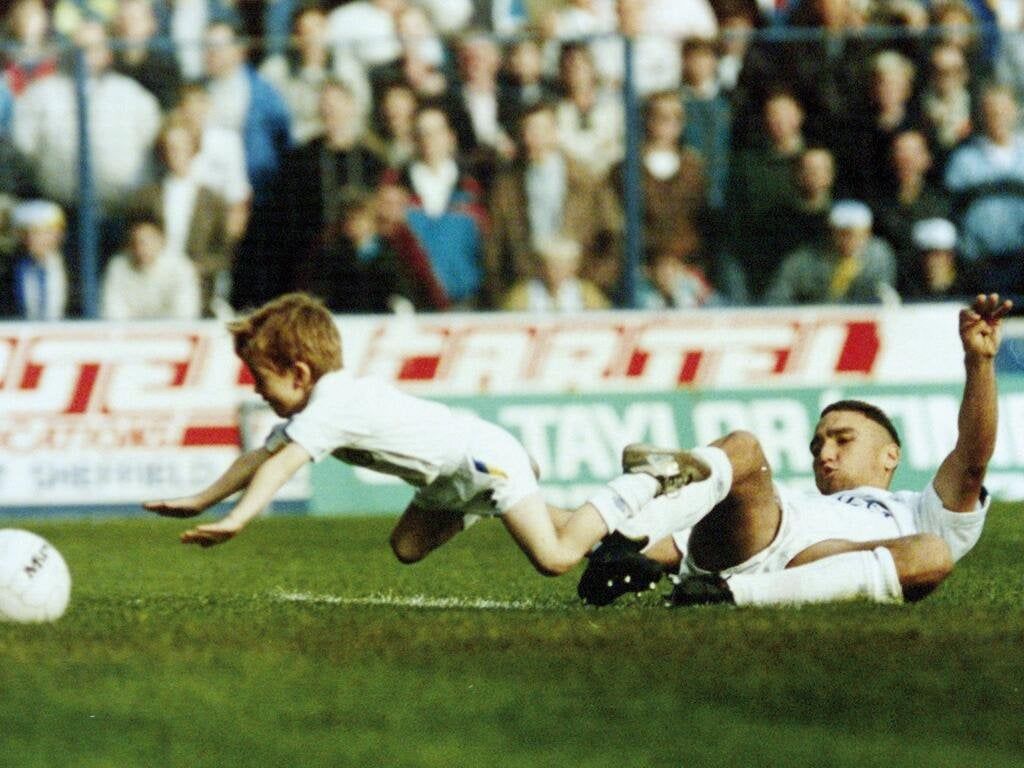 1024x768 What's your favourite football photo? Here's mine. Vinnie Jones slide tackling a child