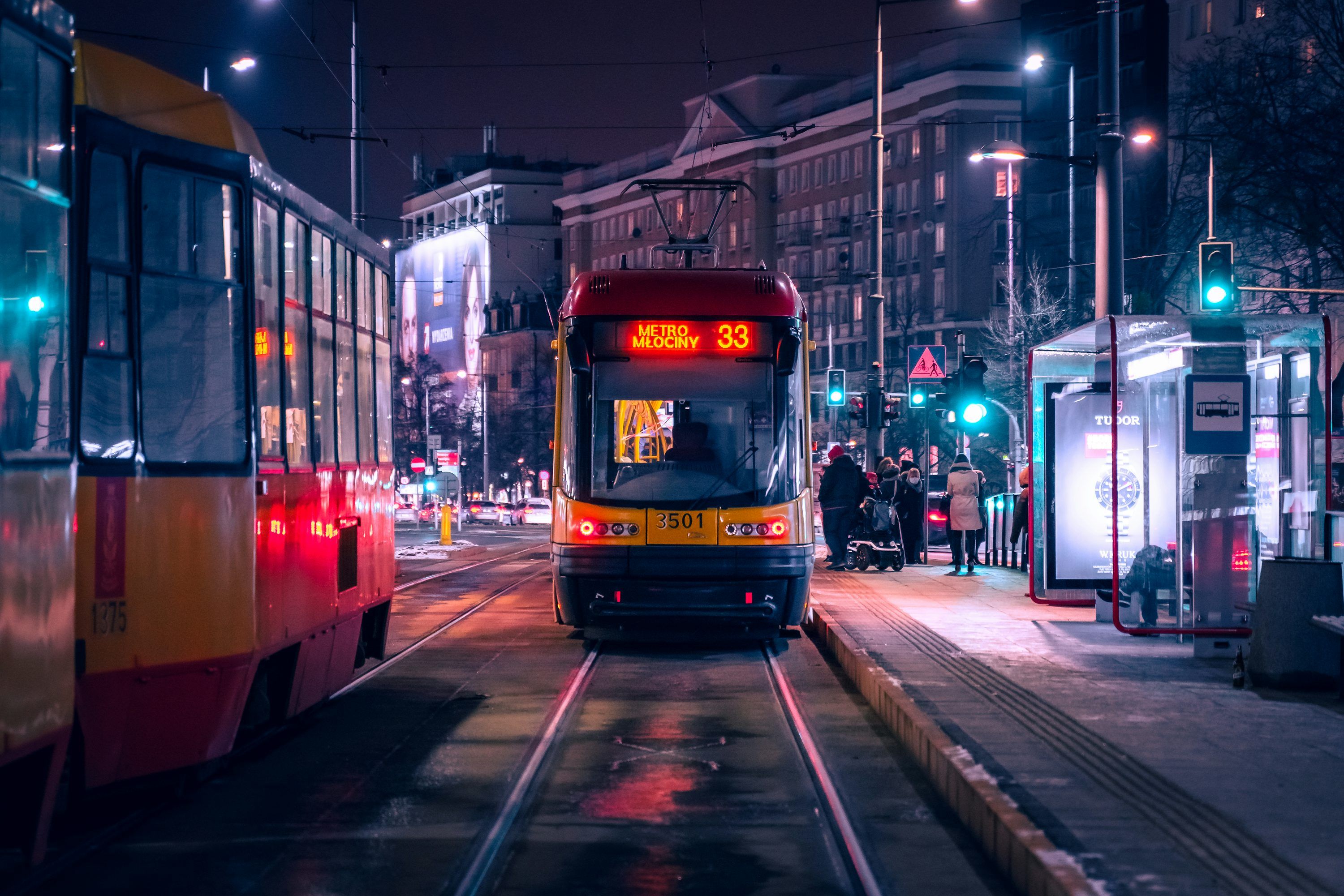 3000x2001 Red and black tram on road during night time photo