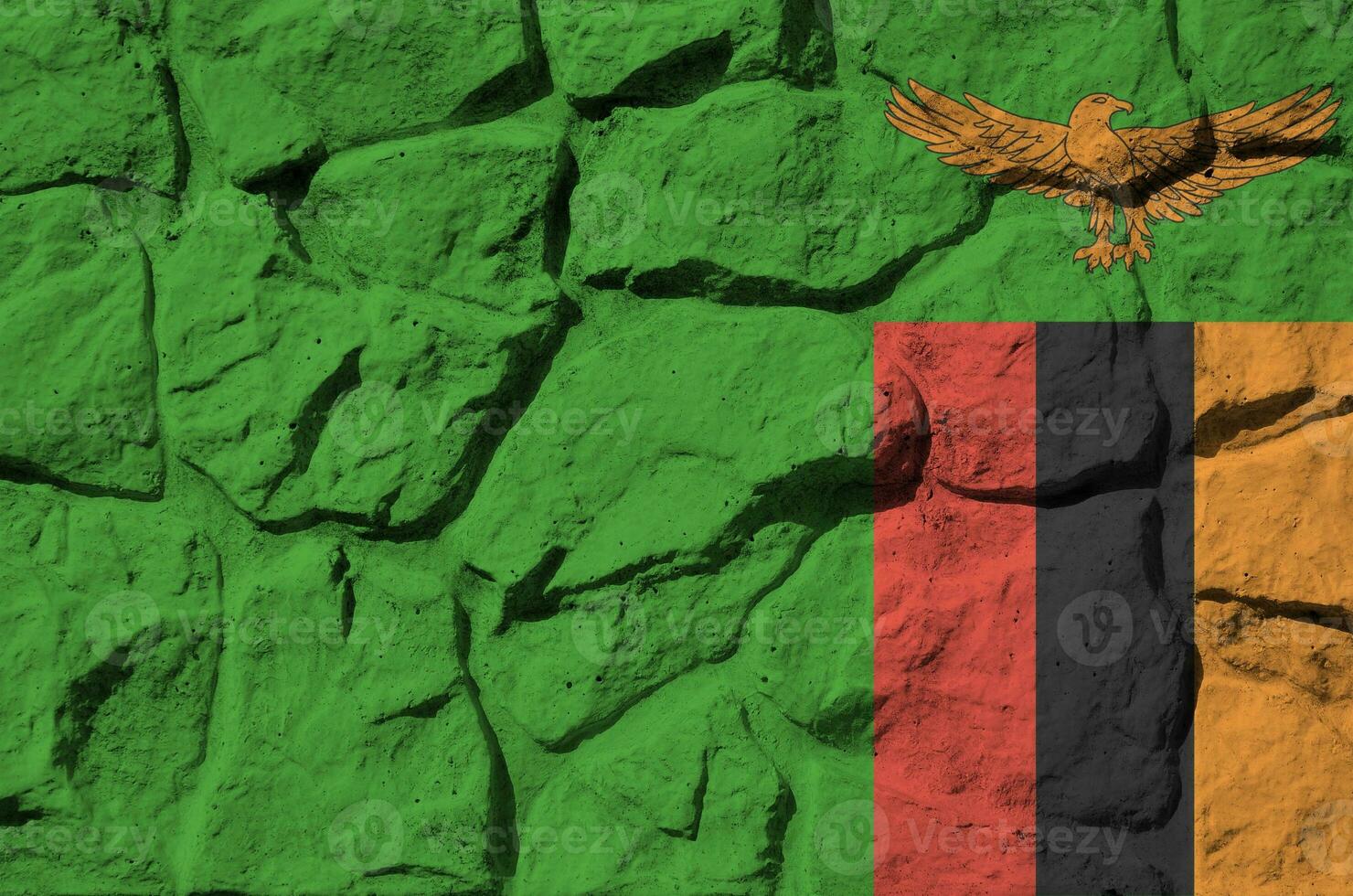 1480x980 Zambia flag depicted in paint colors on old stone wall closeup. Textured banner on rock wall background