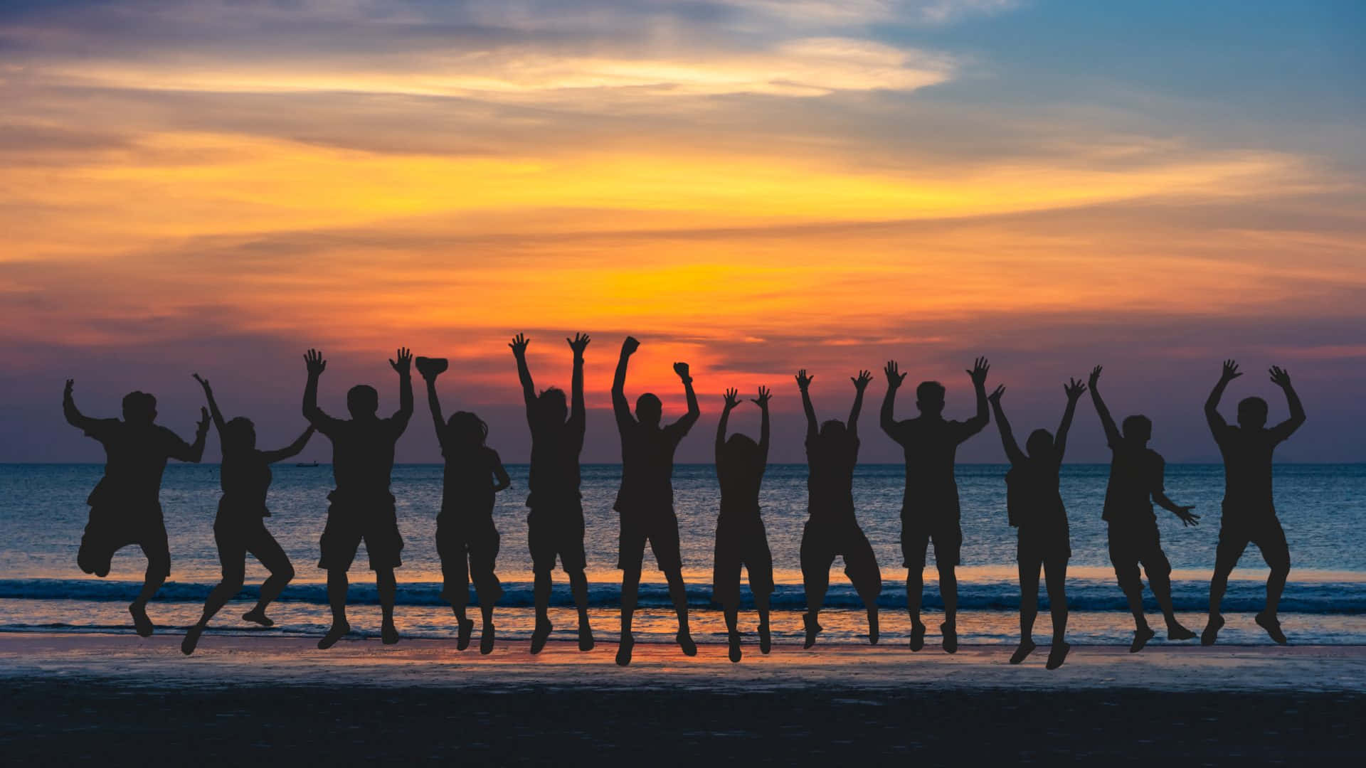 1920x1080 Download Caption: Vibrant Beach Party at Golden Hour Wallpaper