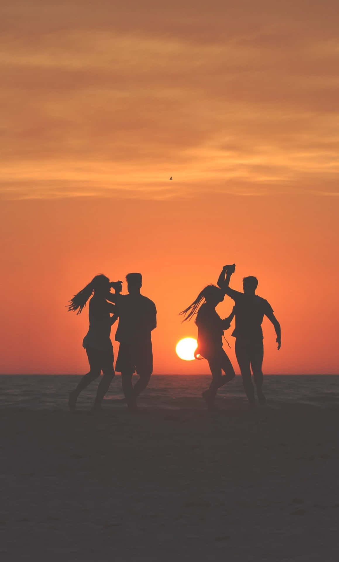 1159x1920 Download Friends enjoying a lively beach dance party Wallpaper
