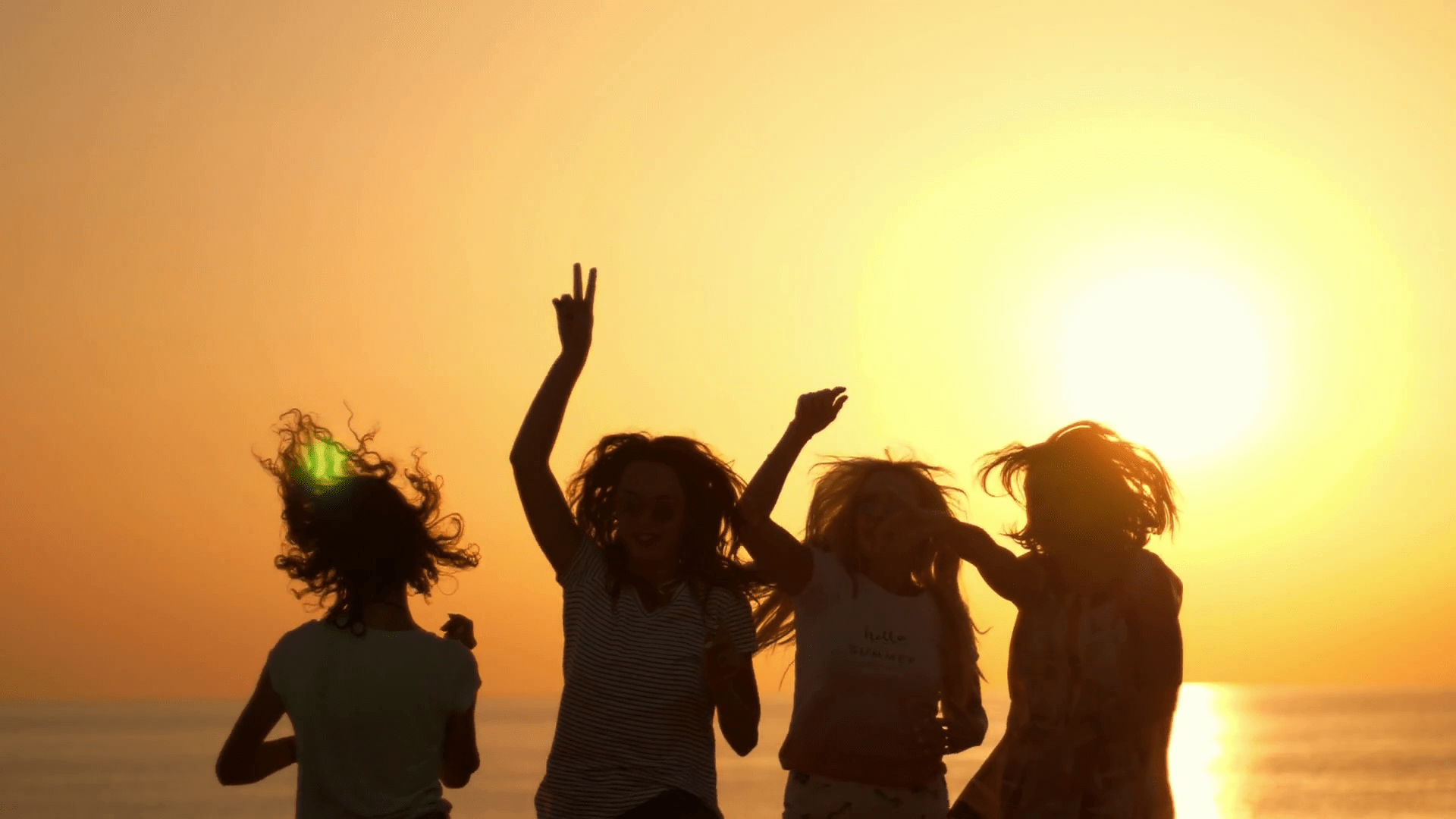 1920x1080 Dancing woman party at beach sunset. Playful girls silhouettes on summer sunset. Enjoy summertime at summer party. Woman have fun with hands up at sun set. Jumping woman silhouettes