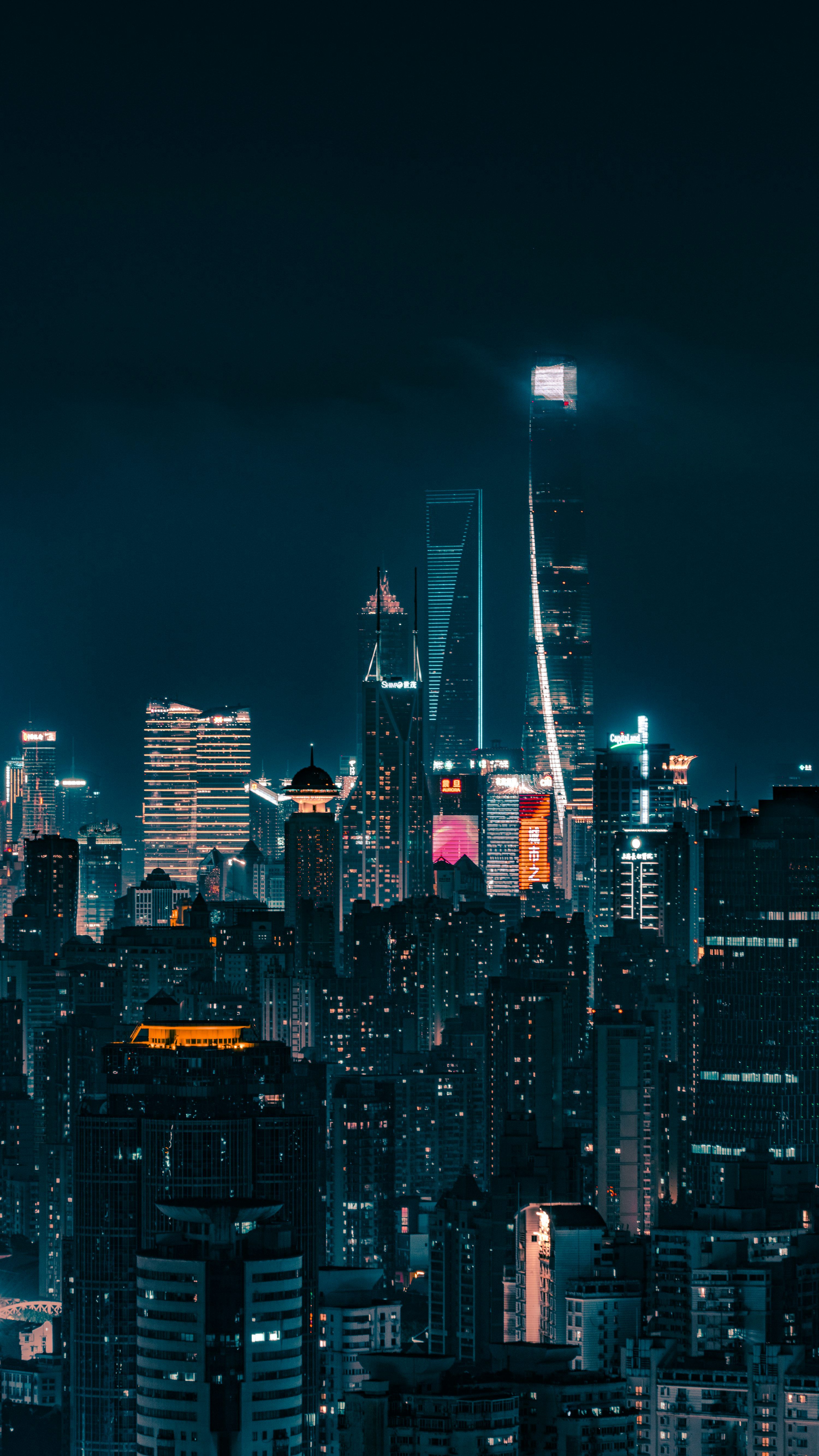 3000x5333 Modern city skyline illuminated at night photo