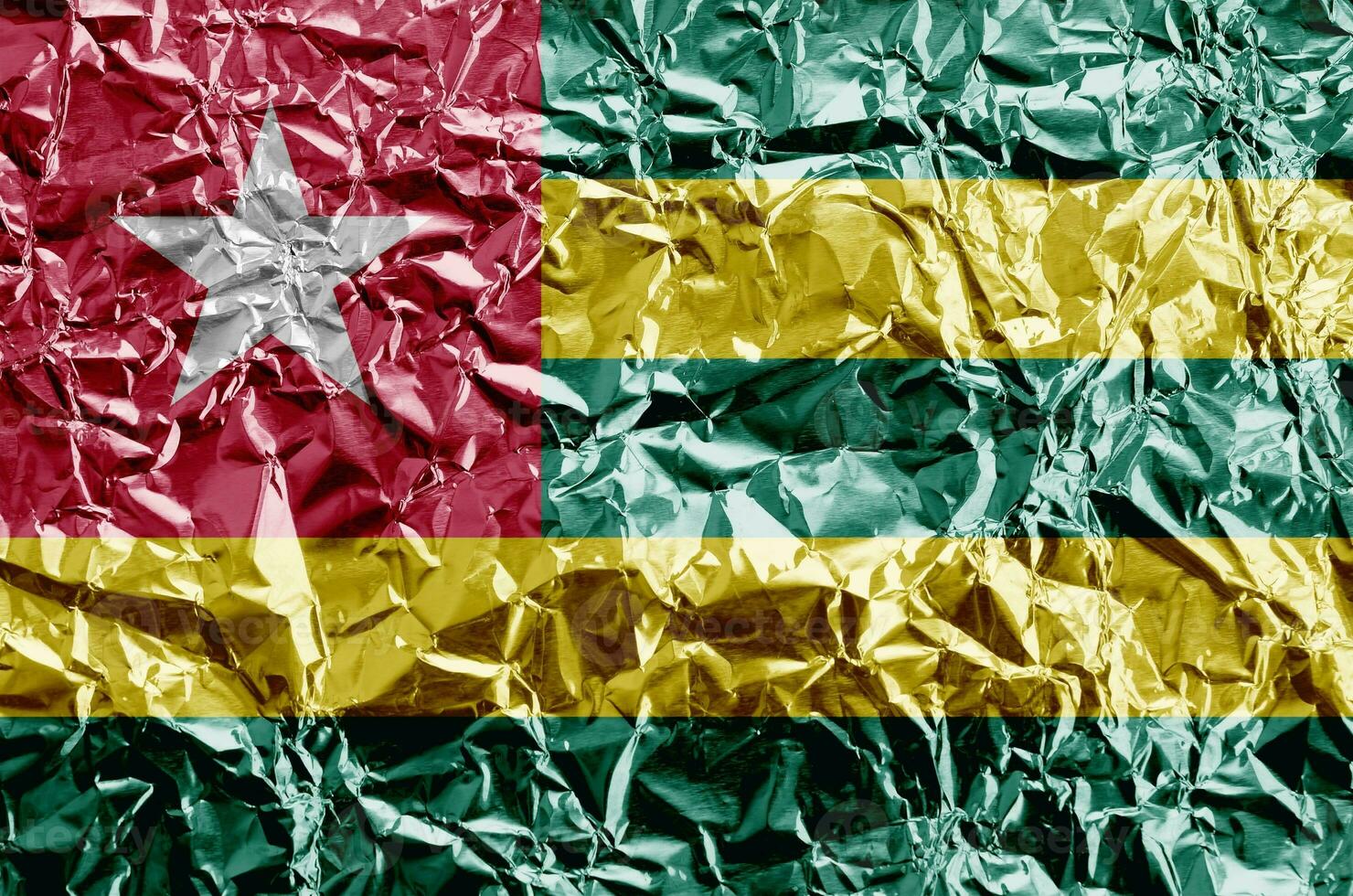 1480x980 Togo flag depicted in paint colors on shiny crumpled aluminium foil closeup. Textured banner on rough background