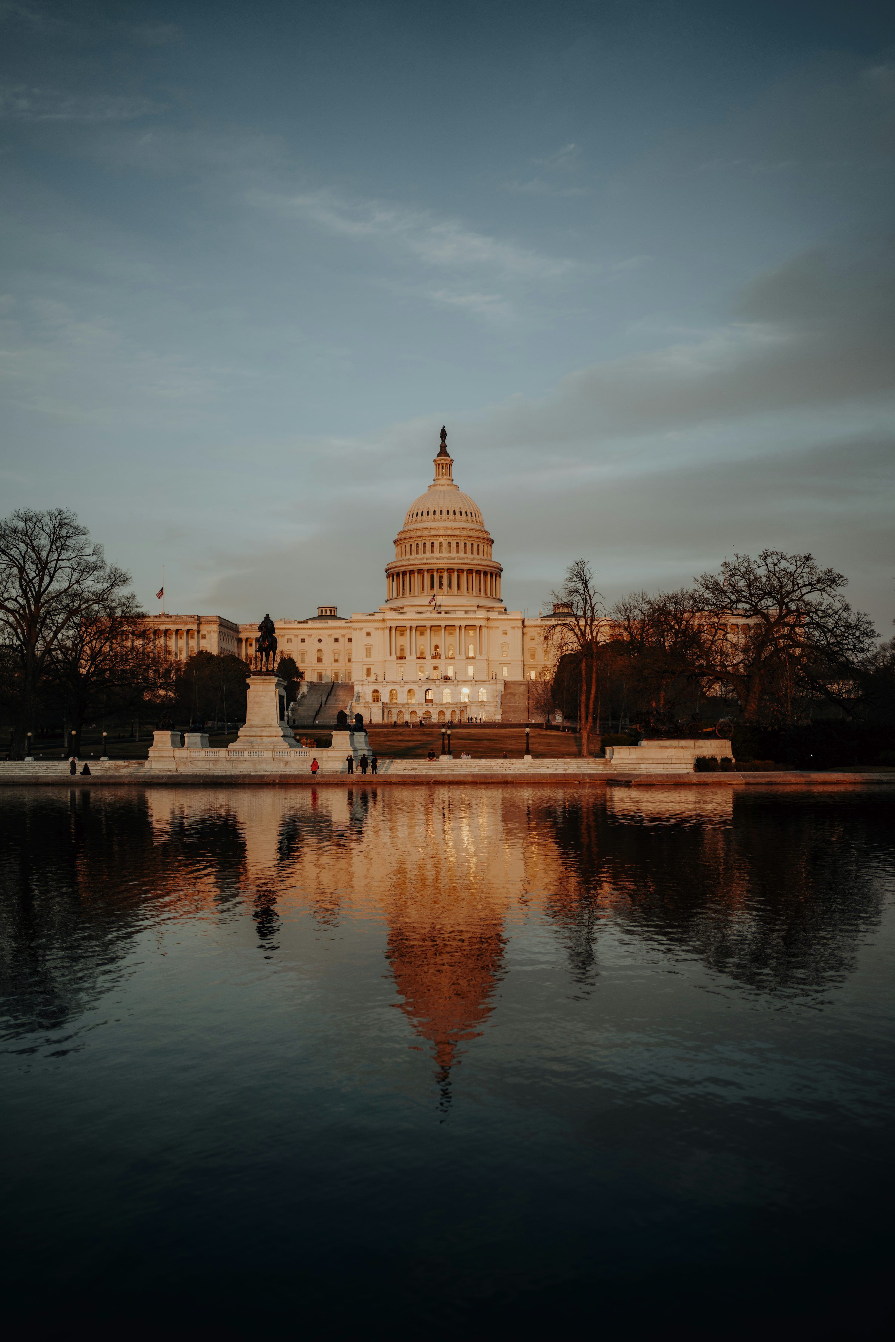 3000x4500 The united states capitol building is reflected in water. photo