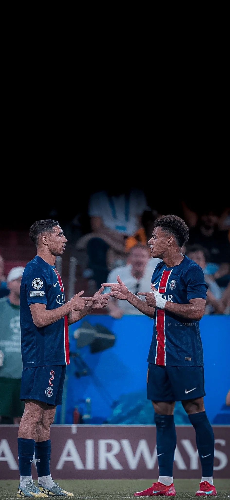 945x2048 Achraf Hakimi and Presnel Kimpembe on pitch for PS Football Wallpaper