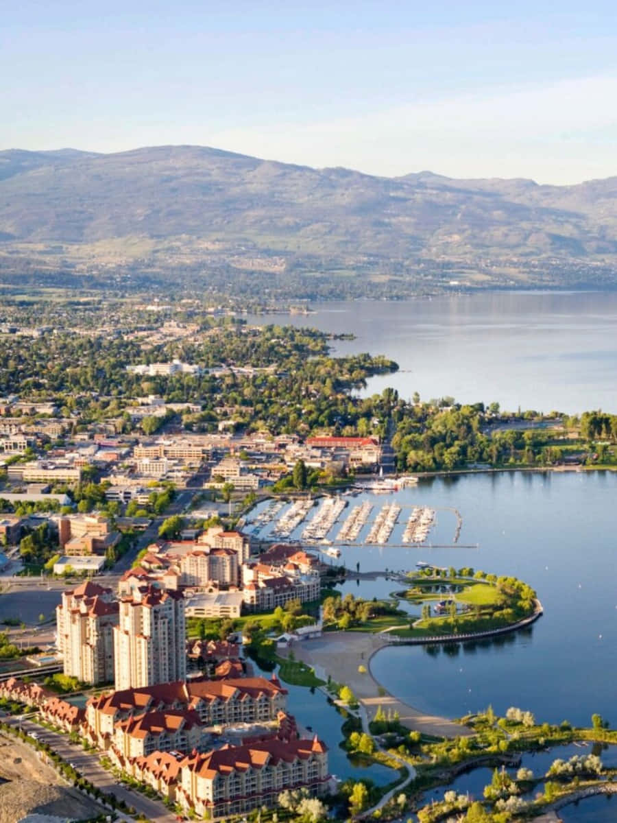 900x1200 Download Breathtaking Sunset View At Kelowna's Waterfront Park Wallpaper