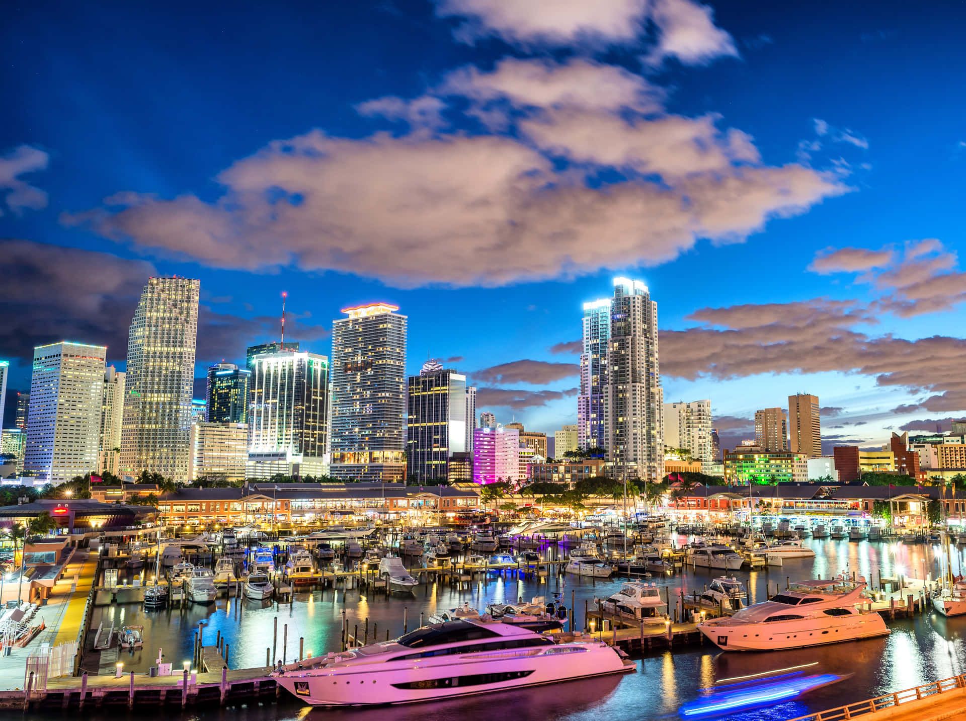 1920x1433 Download Miami City Skyline At Night With Boats Docked Wallpaper