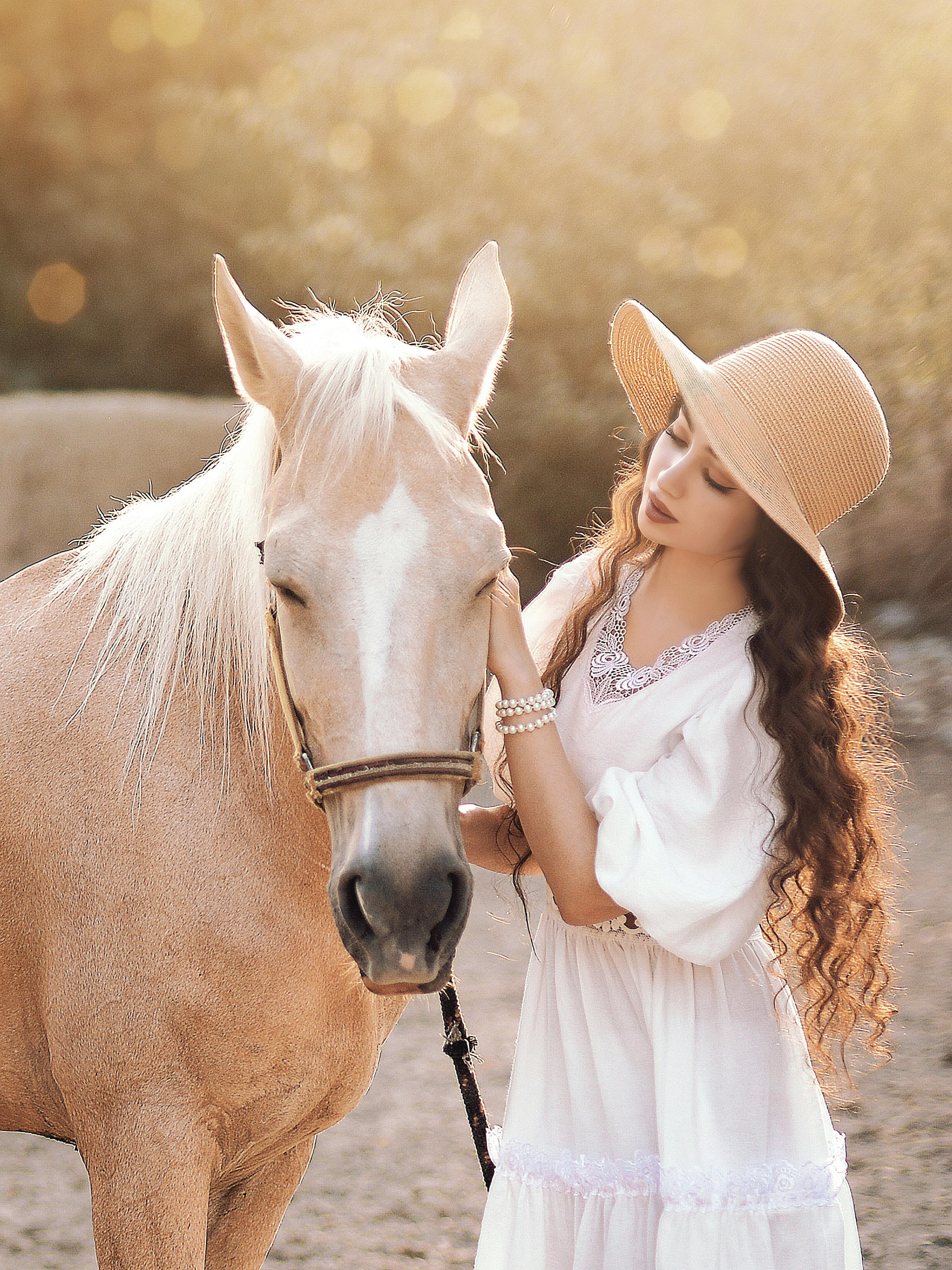 3012x4016 Young Woman Wearing a Hat and White Dress with a Horse · Free