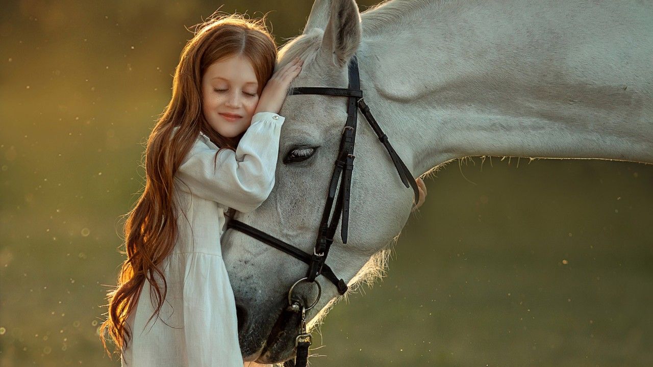 1280x720 Cute Little Girl With Closed Eyes Is Leaning On White Horse Wearing White Dress In Sunlight Background HD Cute Wallpaper