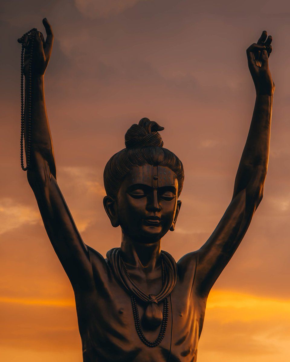 960x1200 As the sun bids its golden farewell, the silhouette of Nilkanth Varni stands in silent reverence. The tranquil orange sky mirrors the hues of devotion, casting a canvas of creativity across the