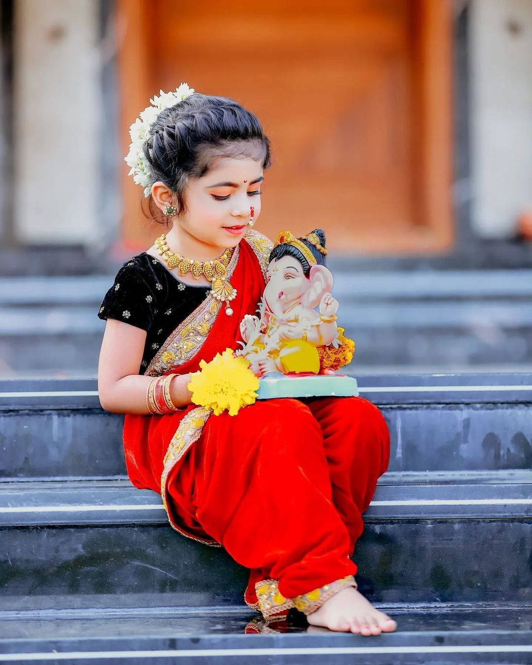 1080x1350 Download Cute Baby Girl Holding Figurine Wallpaper