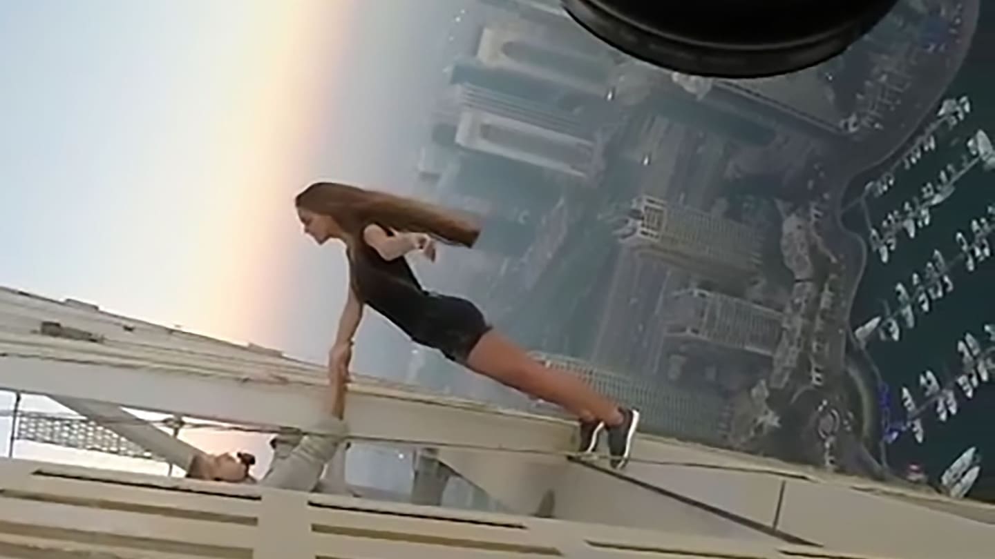 1440x810 Russian model risks her life by dangling off a 307 metre skyscraper for the perfect picture