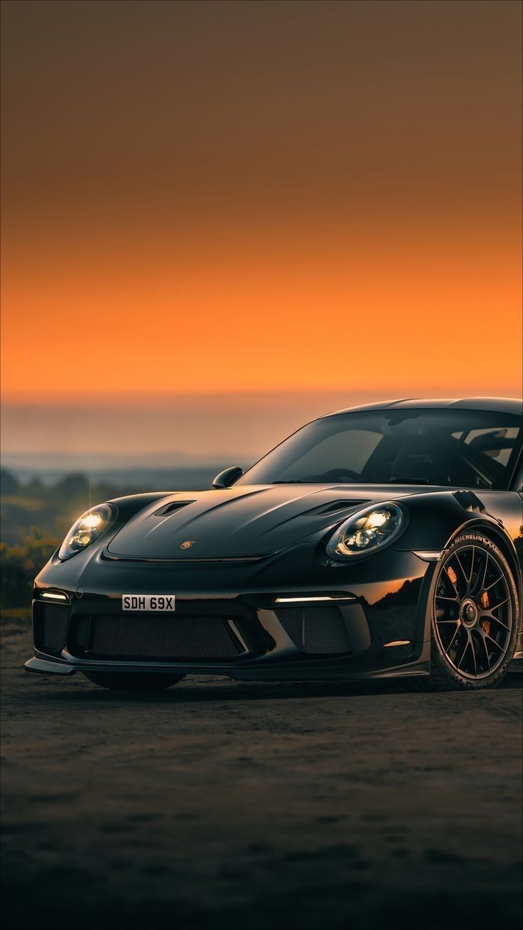736x1308 Black color Porche at sunset look