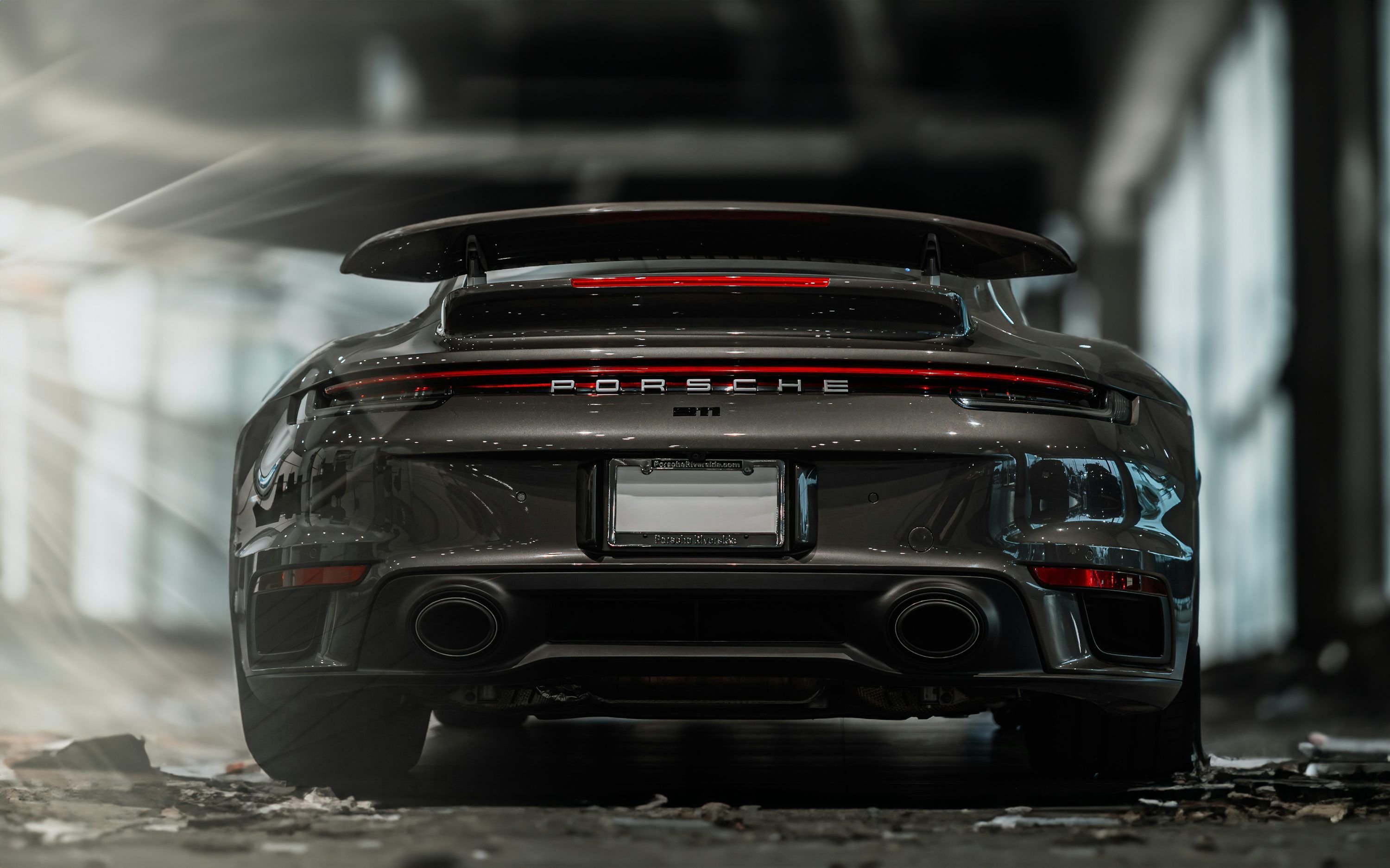 3000x1875 The rear end of a grey porsche sports car photo