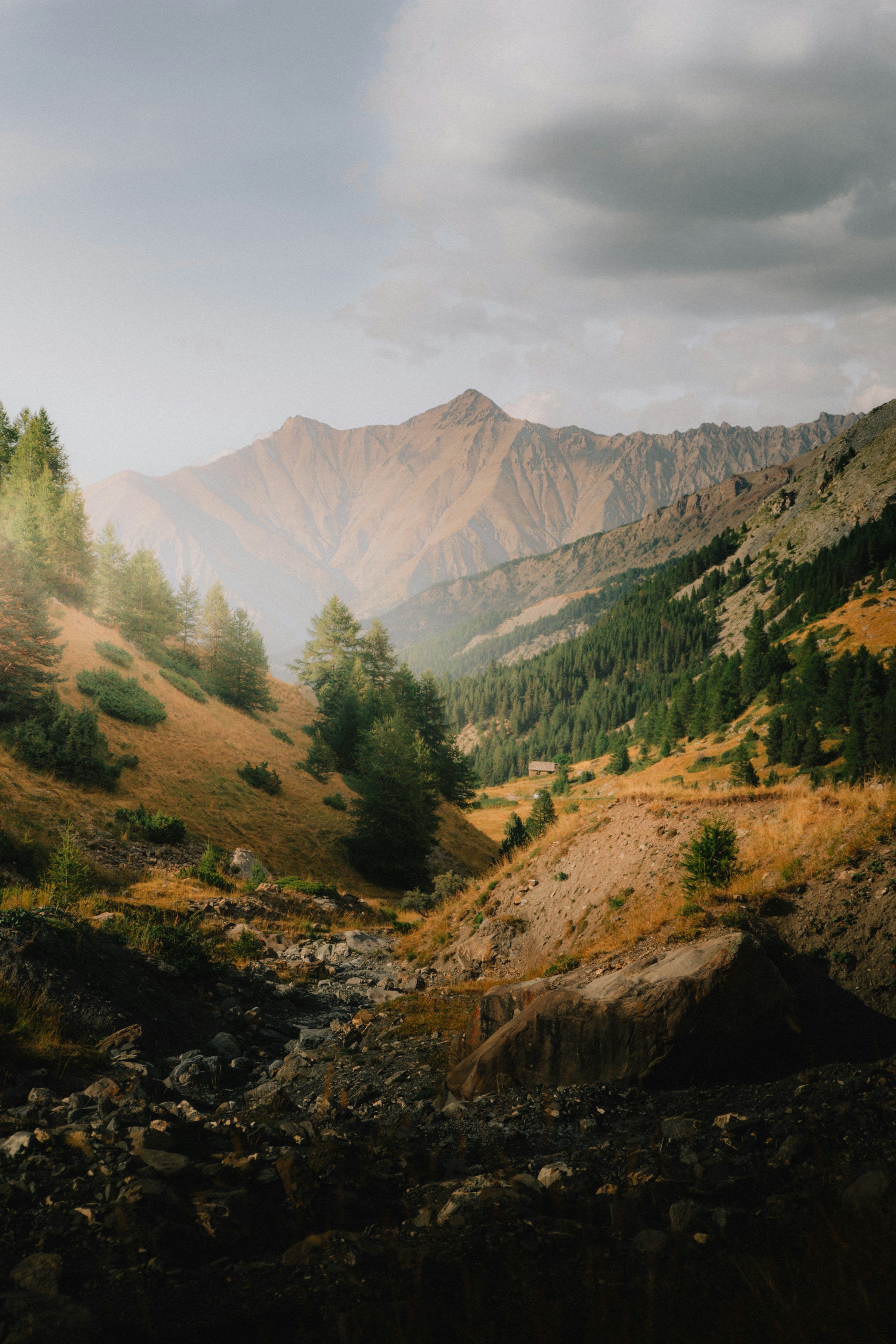 3000x4500 A view of a valley with mountains in the background photo