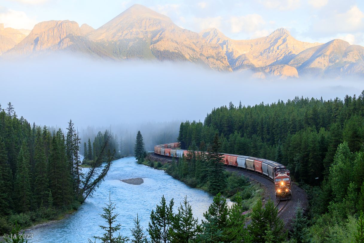 1217x811 Railpicture.ca Photo: Snaking along the banks of the Bow river, this eastbound potash train rolls eastward through Morant's Curve with CP 8754 on point. Railpicture.ca