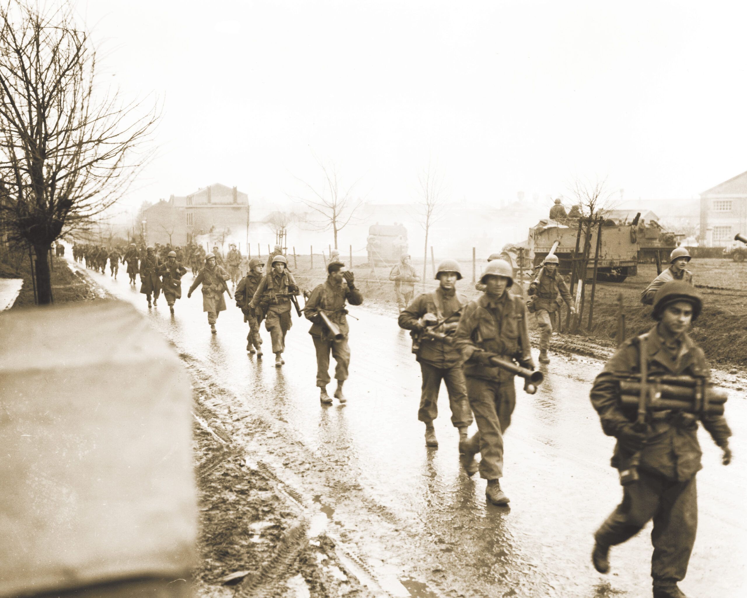 2560x2048 101st Airborne Division soldiers leave Bastogne in January 1945. Battle Monuments Commission (ABMC)