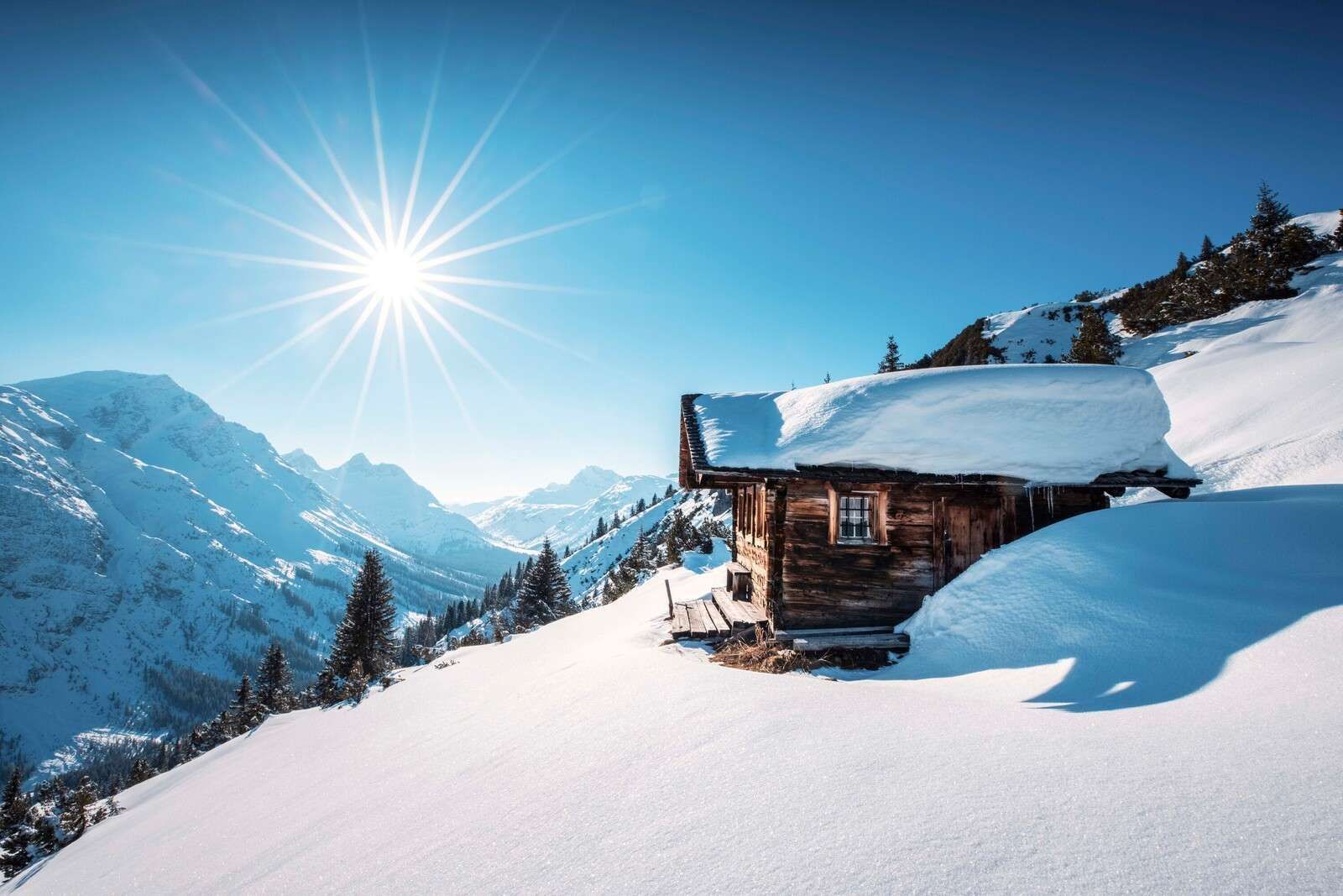 1600x1067 Wallpaper Mural sun above wooden mountain hut