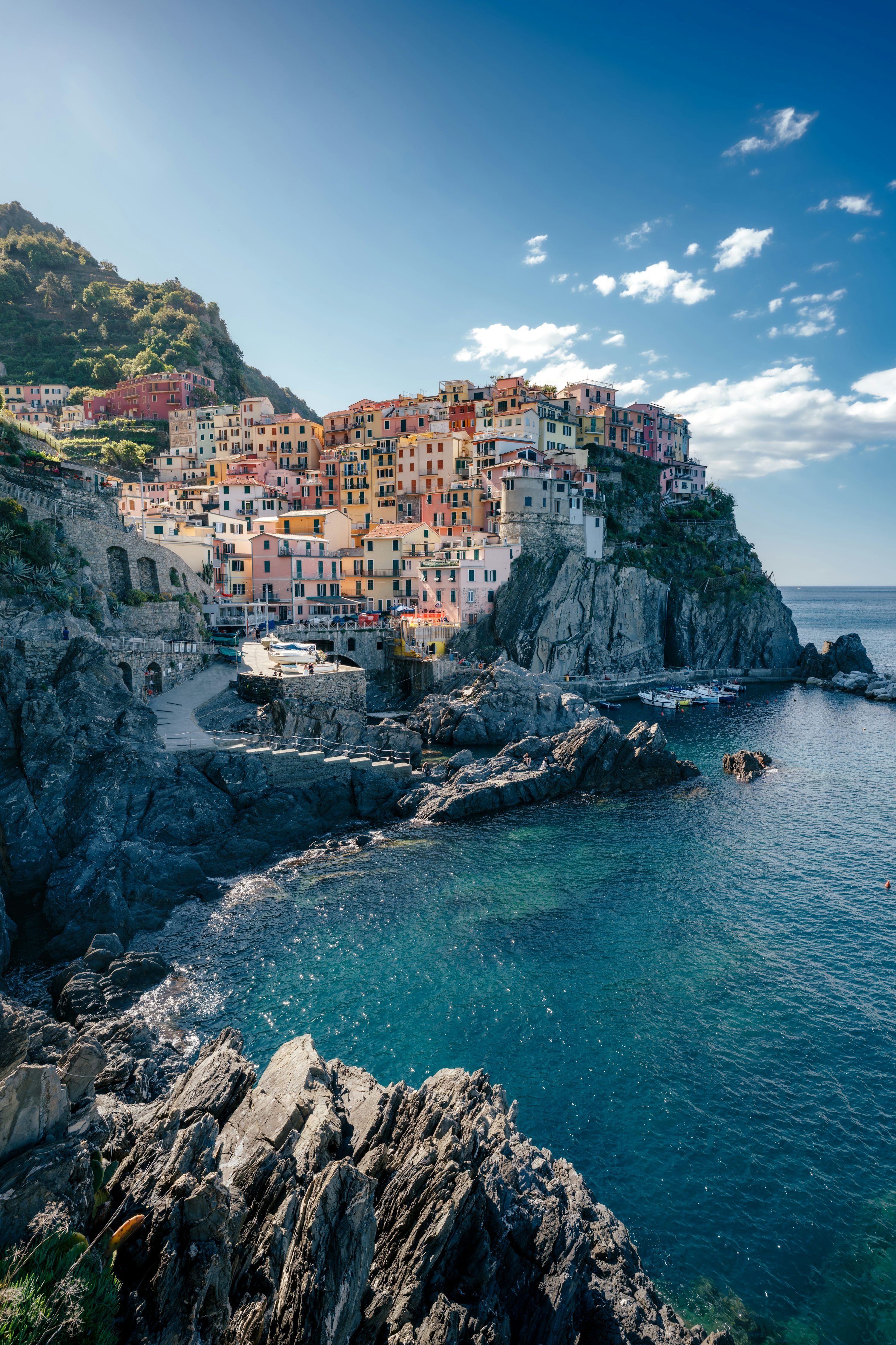 3000x4501 A coastal village sits on a rocky cliff. photo