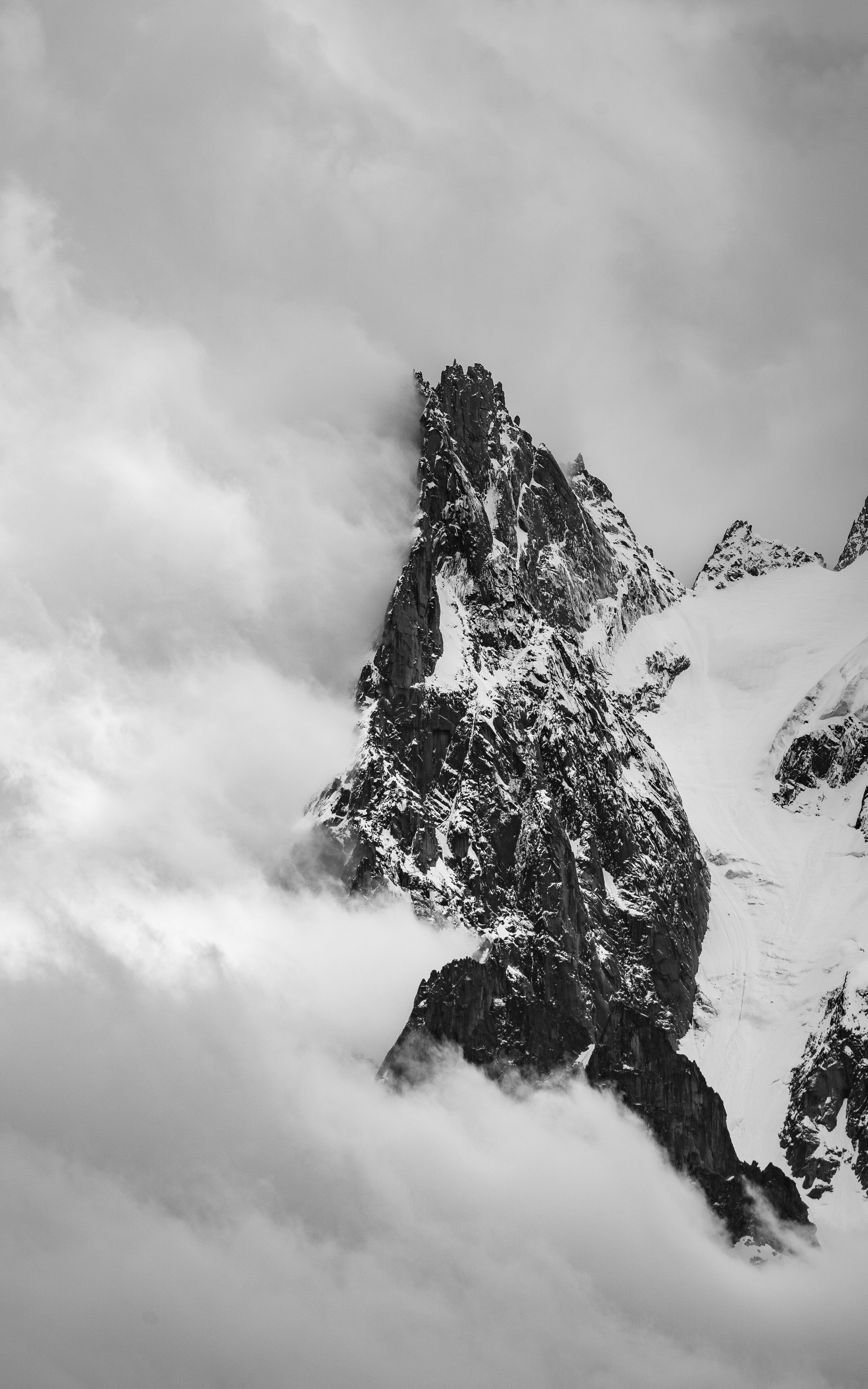 3000x4800 A black and white photo of a snow covered mountain photo