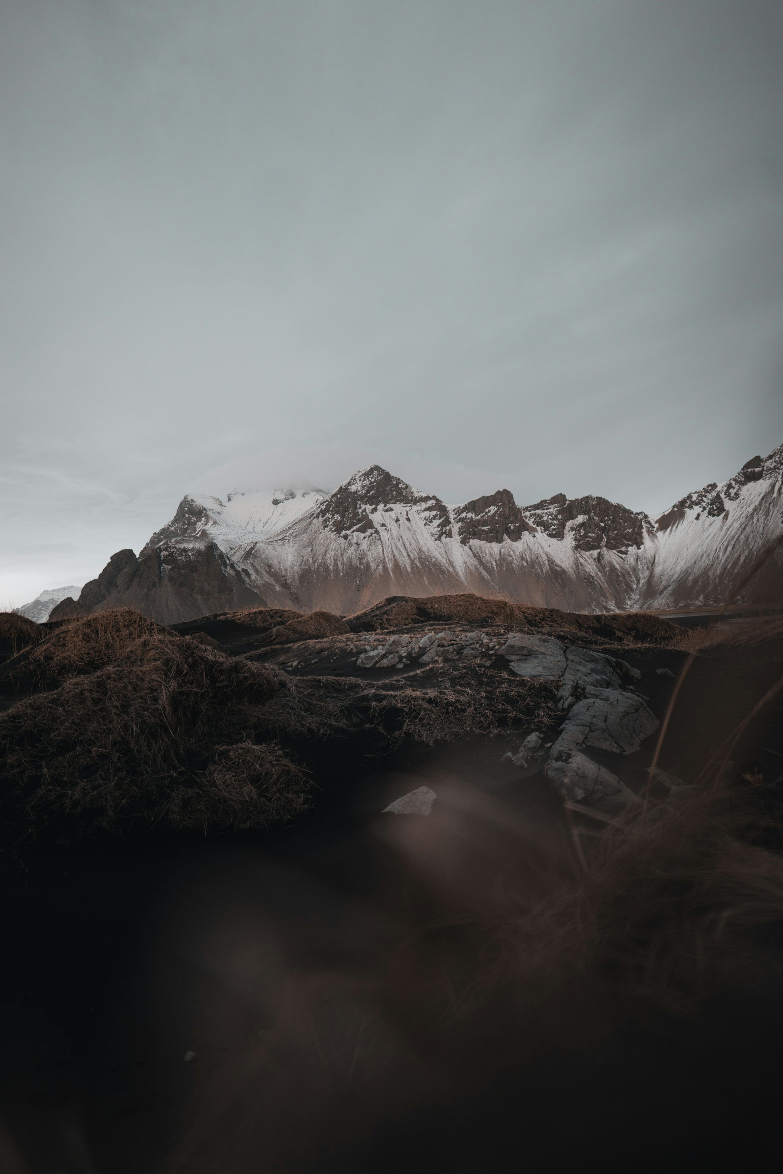 3000x4500 A mountain range with snow on top of it photo