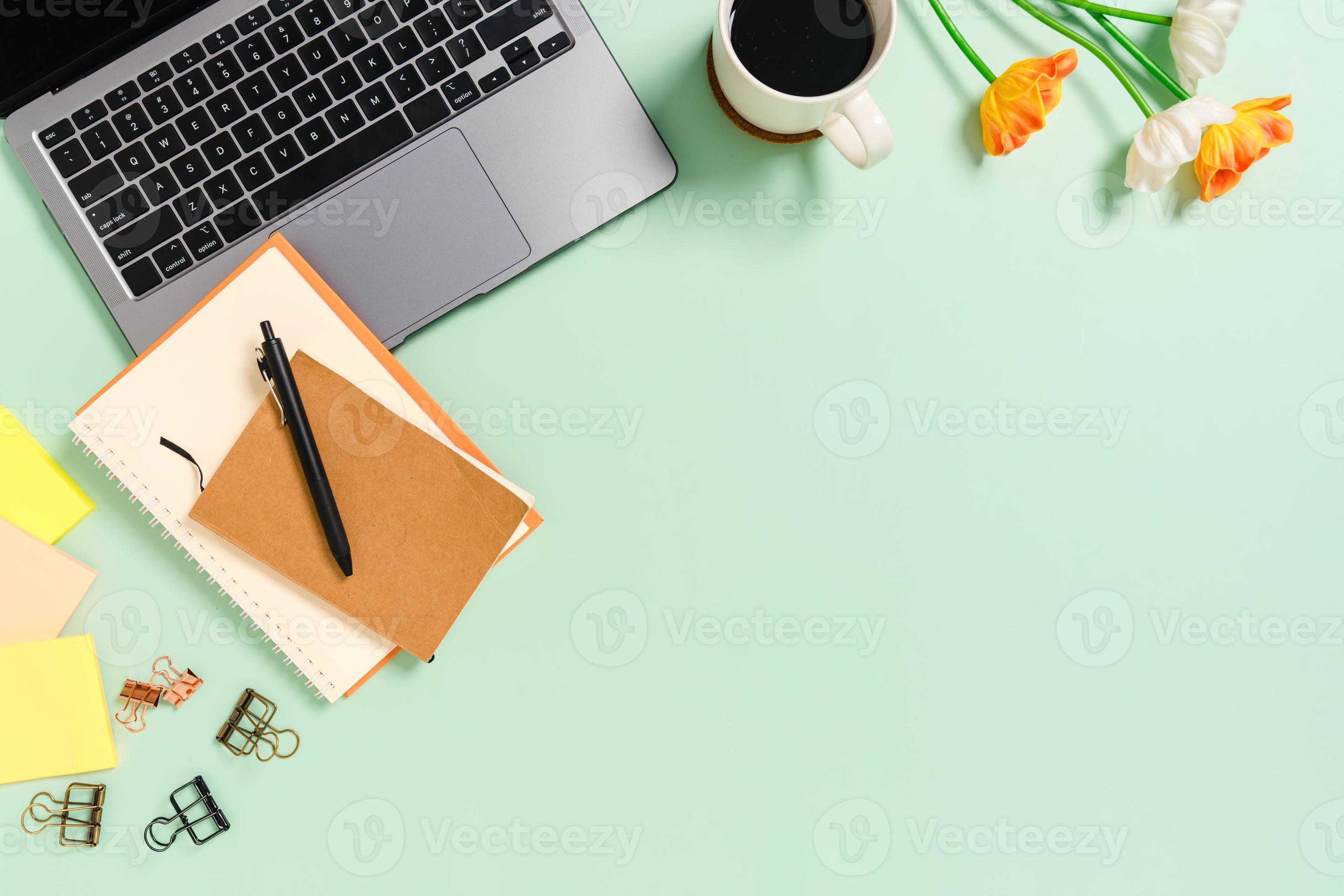 2940x1960 Minimal work space flat lay photo of workspace desk. Top view office desk with laptop, coffee cup and notebook on pastel green color background. Top view with copy space photography