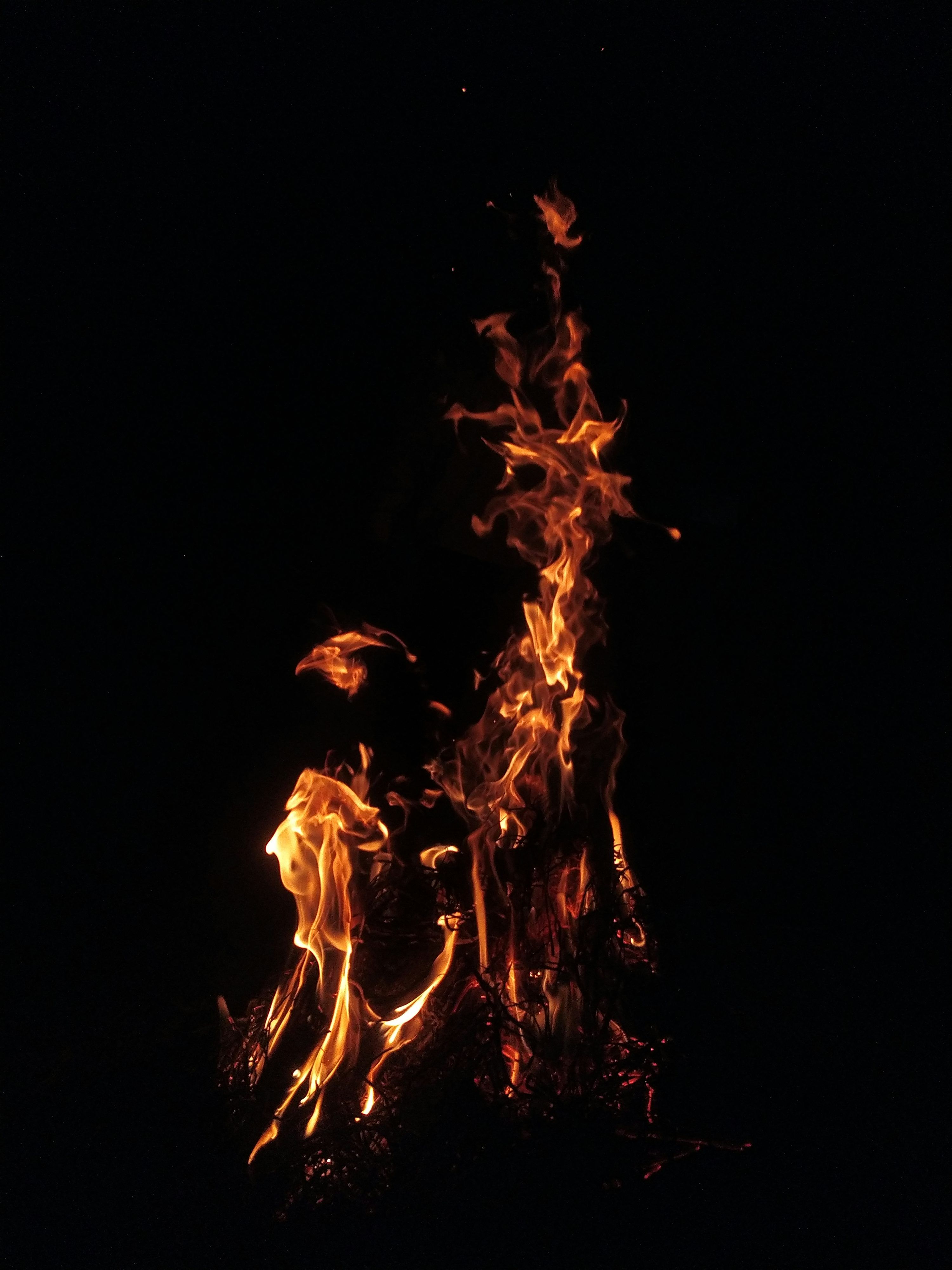 3000x4000 A fire is lit up in the dark photo