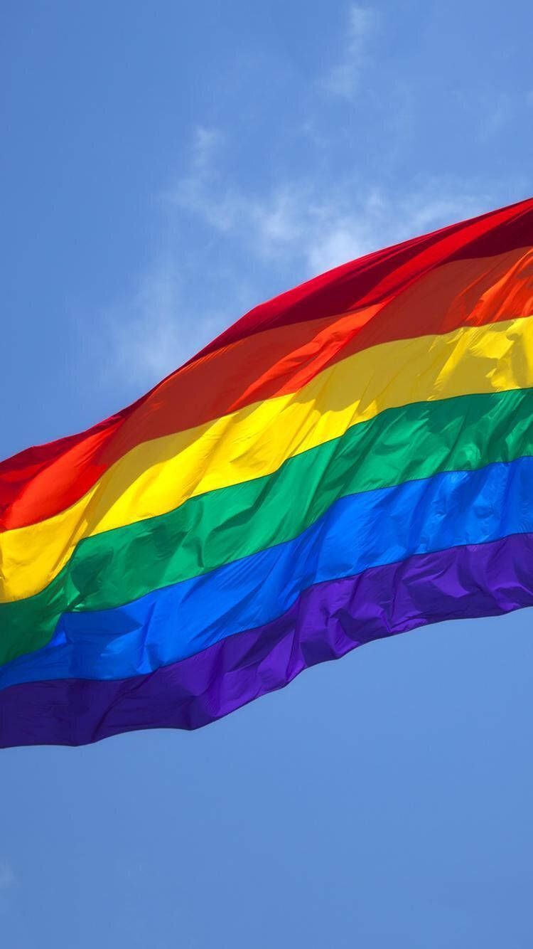 750x1334 Download Unfurling Freedom Vibrant Pride Flag Wallpaper