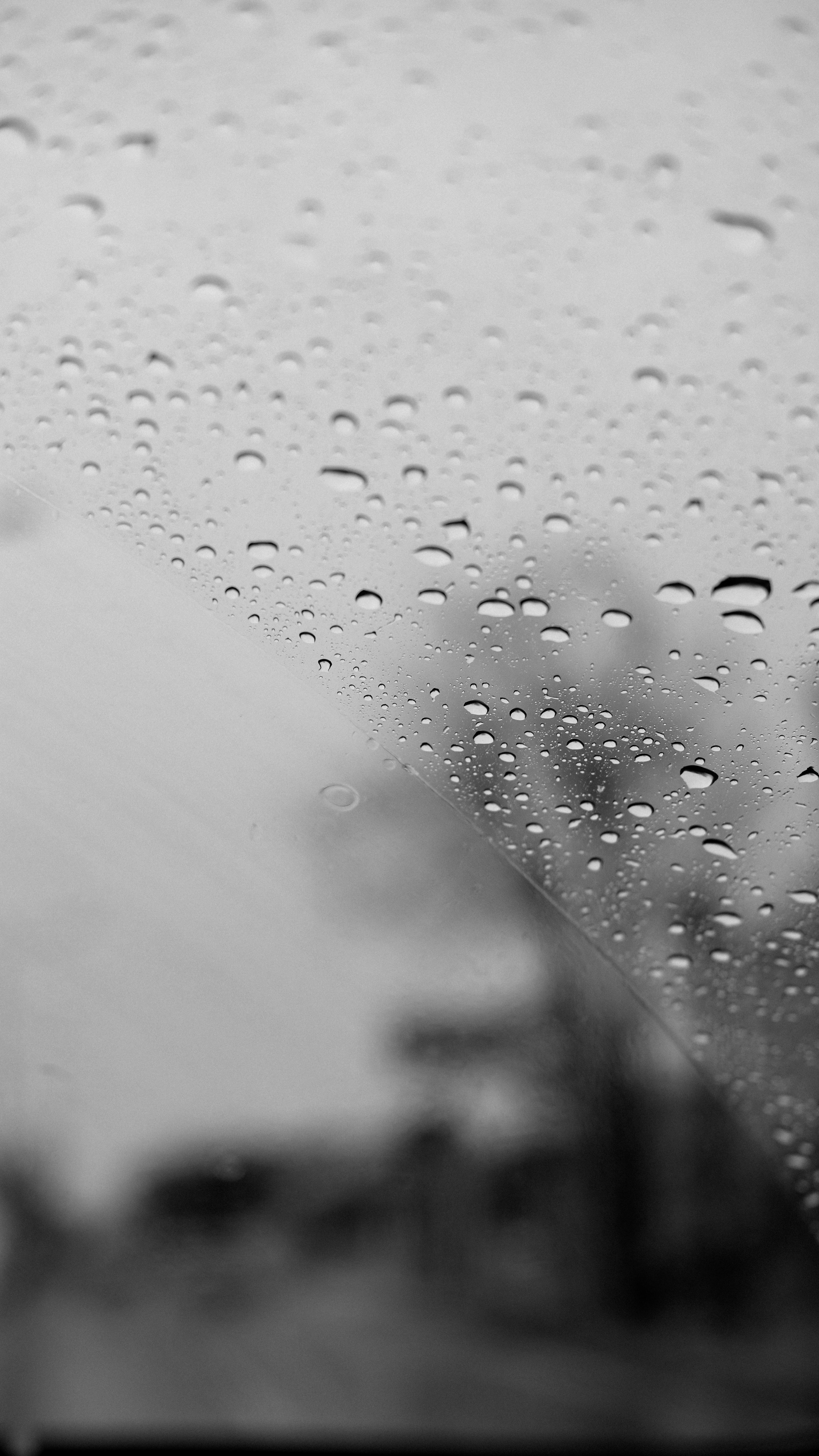 3512x6240 Raindrops on Windshield with Blurred Background · Free
